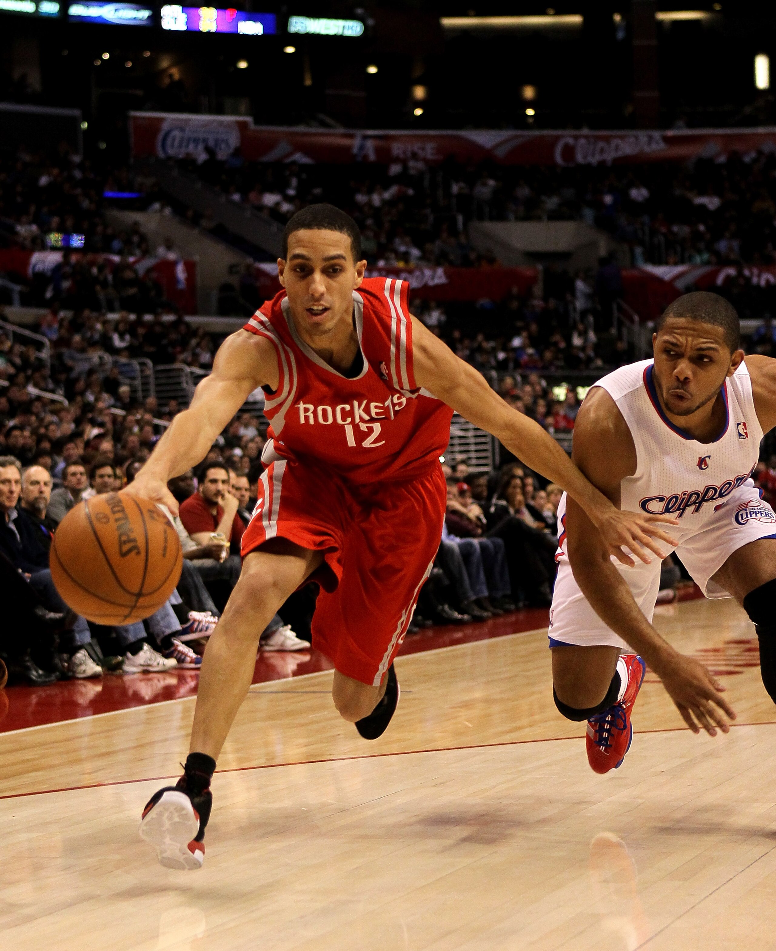 LOS ANGELES, CA - DECEMBER 22: Kevin Martin #12 of the Houston Rockets reaches to control the ball in front of Eric Gordon #10 of the Los Angeles Clippers at Staples Center on December 22, 2010 in Los Angeles, California. NOTE TO USER: User expressly ac LOS ANGELES, CA - DECEMBER 22: Kevin Martin #12 of the Houston Rockets reaches to control the ball in front of Eric Gordon #10 of the Los Angeles Clippers at Staples Center on December 22, 2010 in Los Angeles, California. NOTE TO USER: User expressly ac
