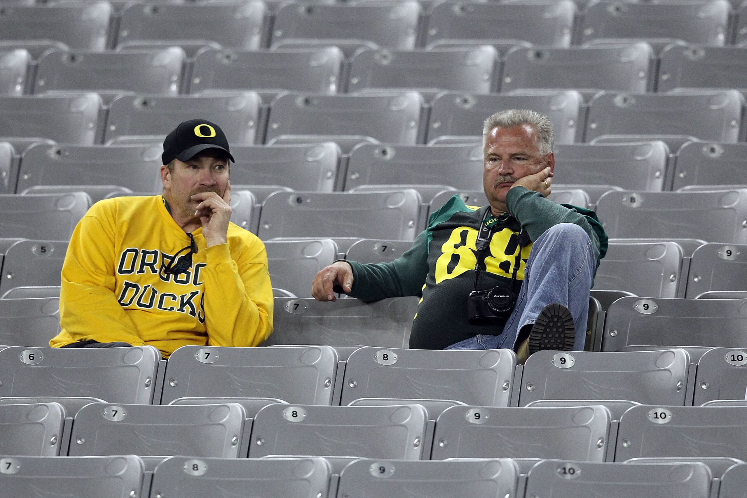 GLENDALE, AZ - JANUARY 10:  Oregon Ducks fans sit in the stands after the Ducks were defeated 22-19 by the Auburn Tigers in the Tostitos BCS National Championship Game at University of Phoenix Stadium on January 10, 2011 in Glendale, Arizona.  (Photo by C