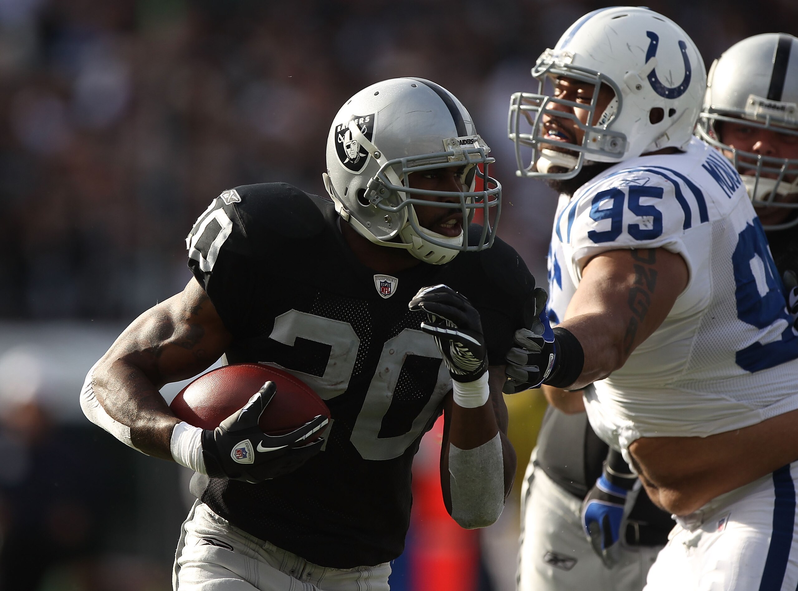 OAKLAND, CA - DECEMBER 26:  Darren McFadden #20 of the Oakland Raiders runs against Fili Moala #95 of the Indianapolis Colts during an NFL game at Oakland-Alameda County Coliseum on December  26, 2010 in Oakland, California.  (Photo by Jed Jacobsohn/Getty