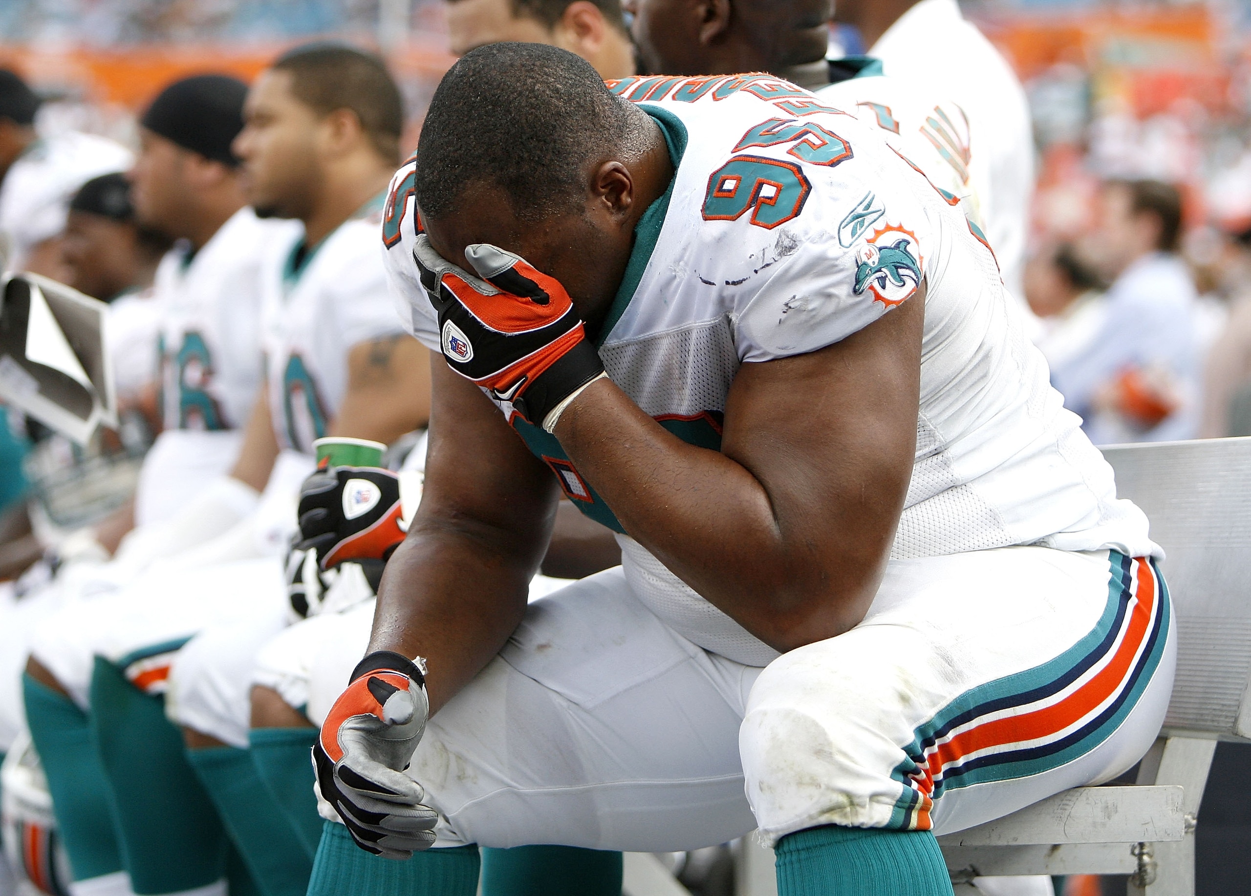 MIAMI - JANUARY 04:  Jason Ferguson #95 of the Miami Dolphins sits on the bench during the final minuets of their 27-9 AFC Wild Card loss to the Baltimore Ravens on January 4, 2009 at Dolphin Stadium in Miami, Florida.  (Photo by Gregory Shamus/Getty Imag
