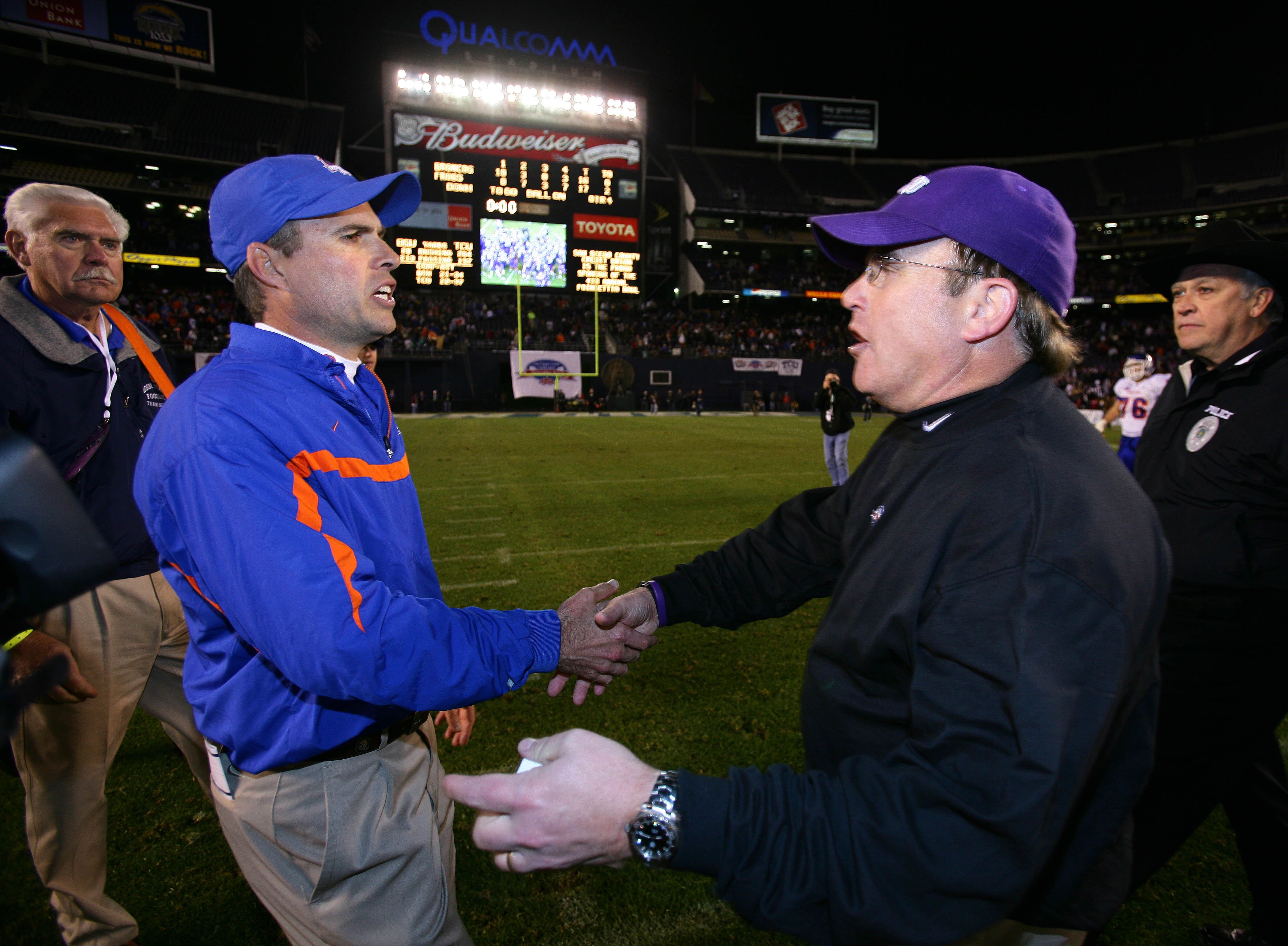 SAN DIEGO, CA - DECEMBER 23:  Head Coach Chris Petersen of the Boise State Broncos meets Heads Coach Gary Patterson of TCU Horned Frogs after the Horned Frogs 17-16 win over the Broncos during the San Diego County Credit Union Poinsettia Bowl at Qualcomm