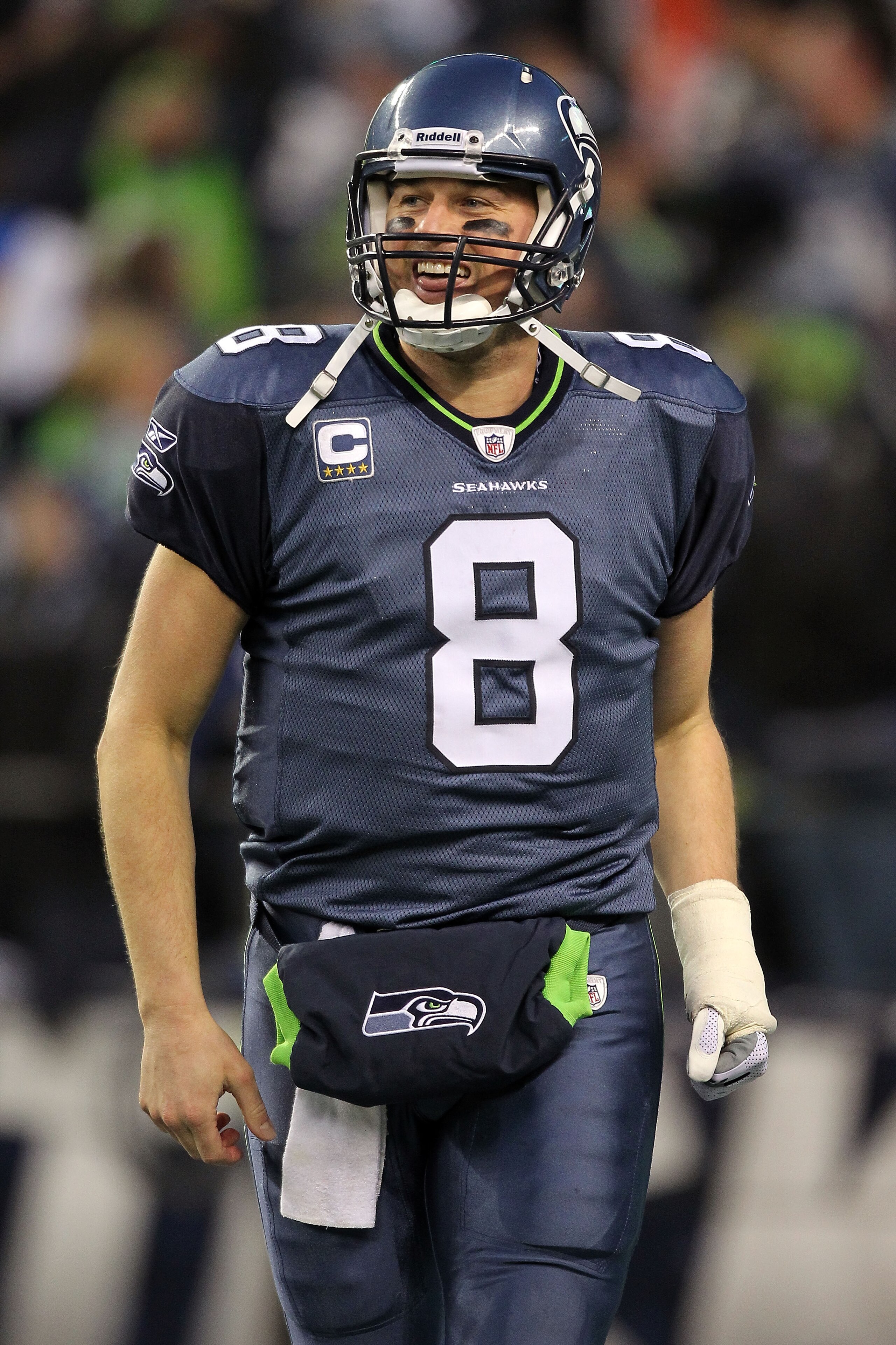 SEATTLE, WA - JANUARY 08:  Quarterback Matt Hasselbeck #8 of the Seattle Seahawks celebrates after running back Marshawn Lynch #24 scores on a 67-yard run in the fourth quarter against the New Orleans Saints during the 2011 NFC wild-card playoff game at Q