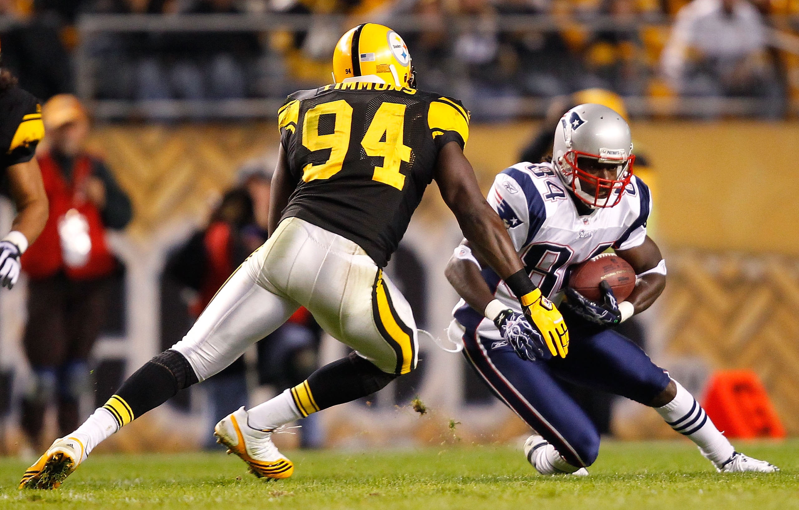 PITTSBURGH, PA - NOVEMBER 14:  Deion Branch #84 of the New England Patriots attempts to run by Lawrence Timmons #94 of the Pittsburgh Steelers during the game on November 14, 2010 at Heinz Field in Pittsburgh, Pennsylvania.  (Photo by Jared Wickerham/Gett