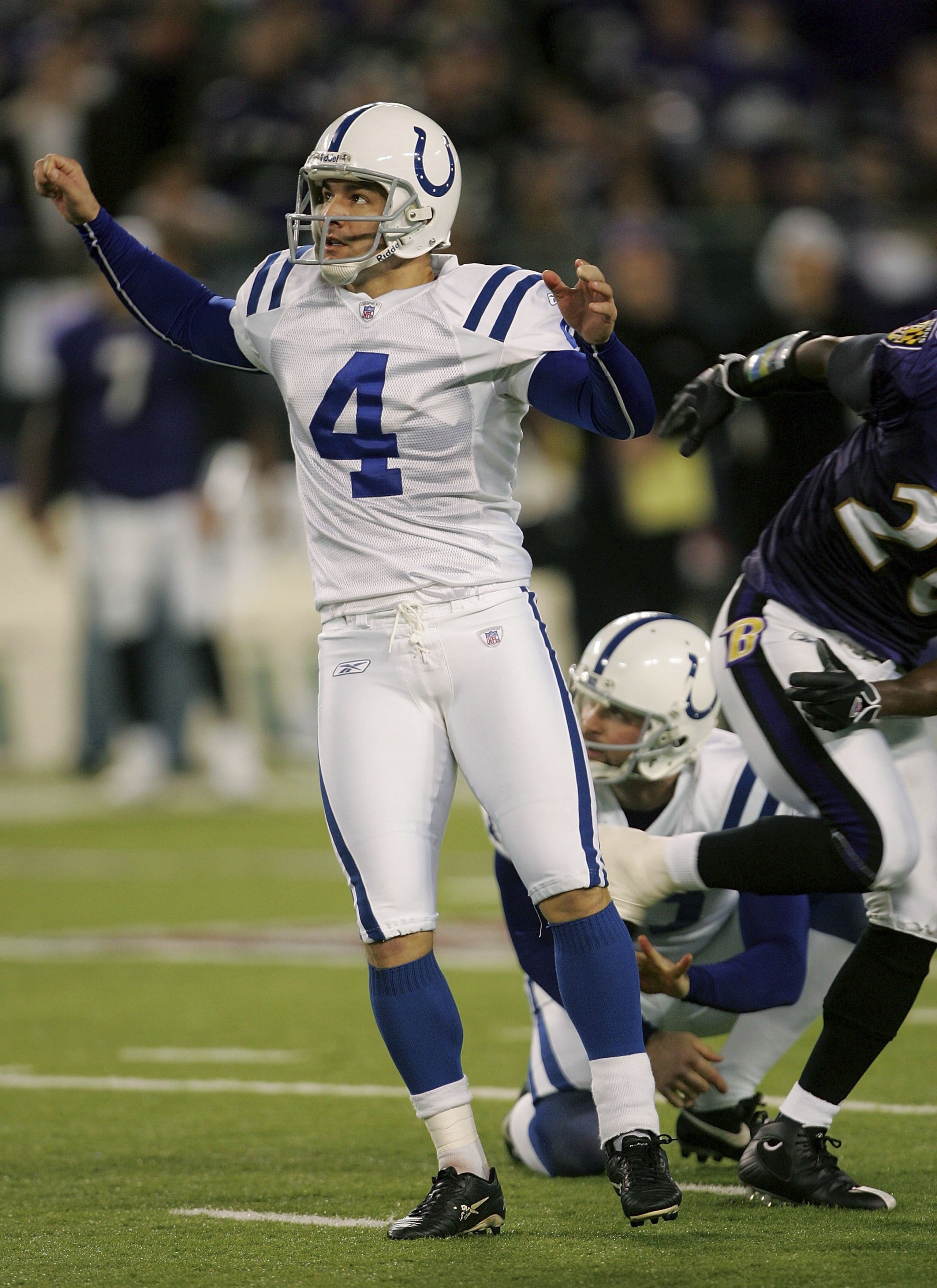 BALTIMORE - JANUARY 13:  Adam Vinatieri #4 of the Indianapolis Colts watches watches a field goal as Hunter Smith #17 holds for him during their AFC Divisional Playoff game against the Baltiomre Ravens on January 13, 2007 at M&T Bank Stadium in Baltimore,