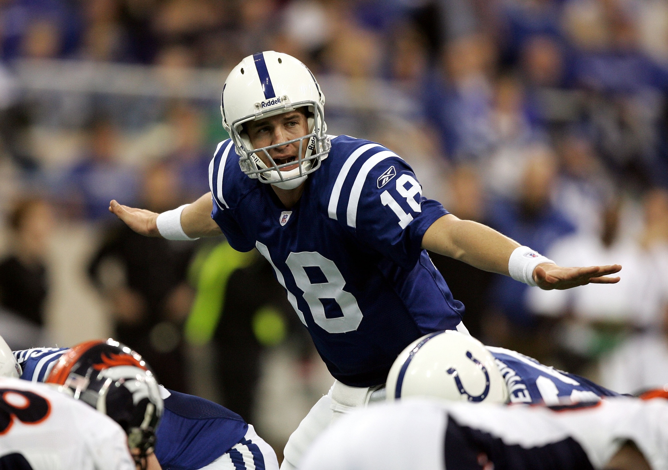 INDIANAPOLIS - JANUARY 09:  Quarterback Peyton Manning #18 of the Indianapolis Colts signals to his team during the fourth quarter against the Denver Broncos in the AFC Wildcard playoff game at the RCA Dome on January 9, 2005 in Indianapolis, Indiana.  Th