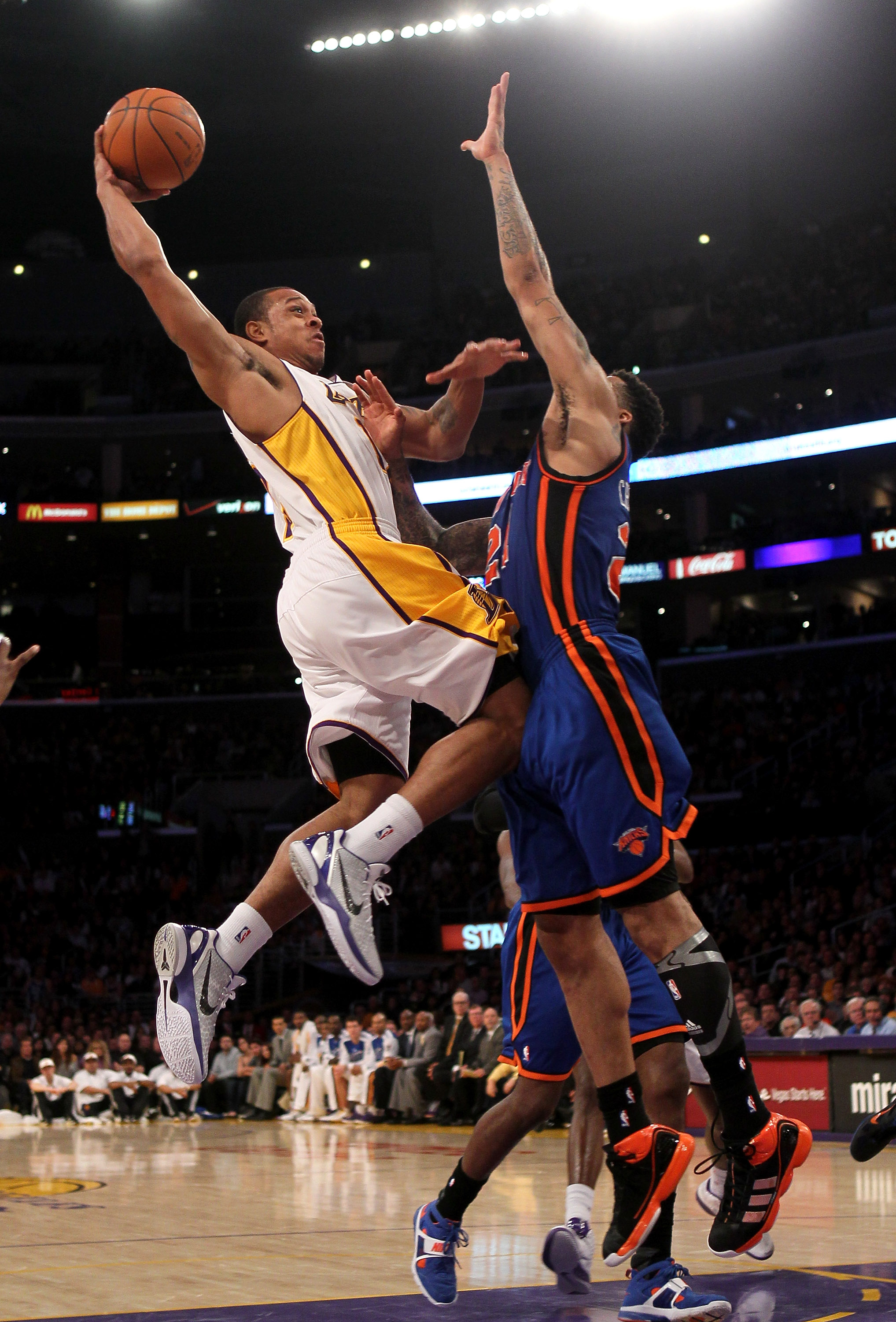 LOS ANGELES, CA - JANUARY 9:  Shannon Brown #12 of the Los Angeles Lakers goes up for a shot against Wilson Chandler #21 of the New York Knicks at Staples Center on January 9, 2011 in Los Angeles, California.  The Lakers won 109-87.   NOTE TO USER: User e