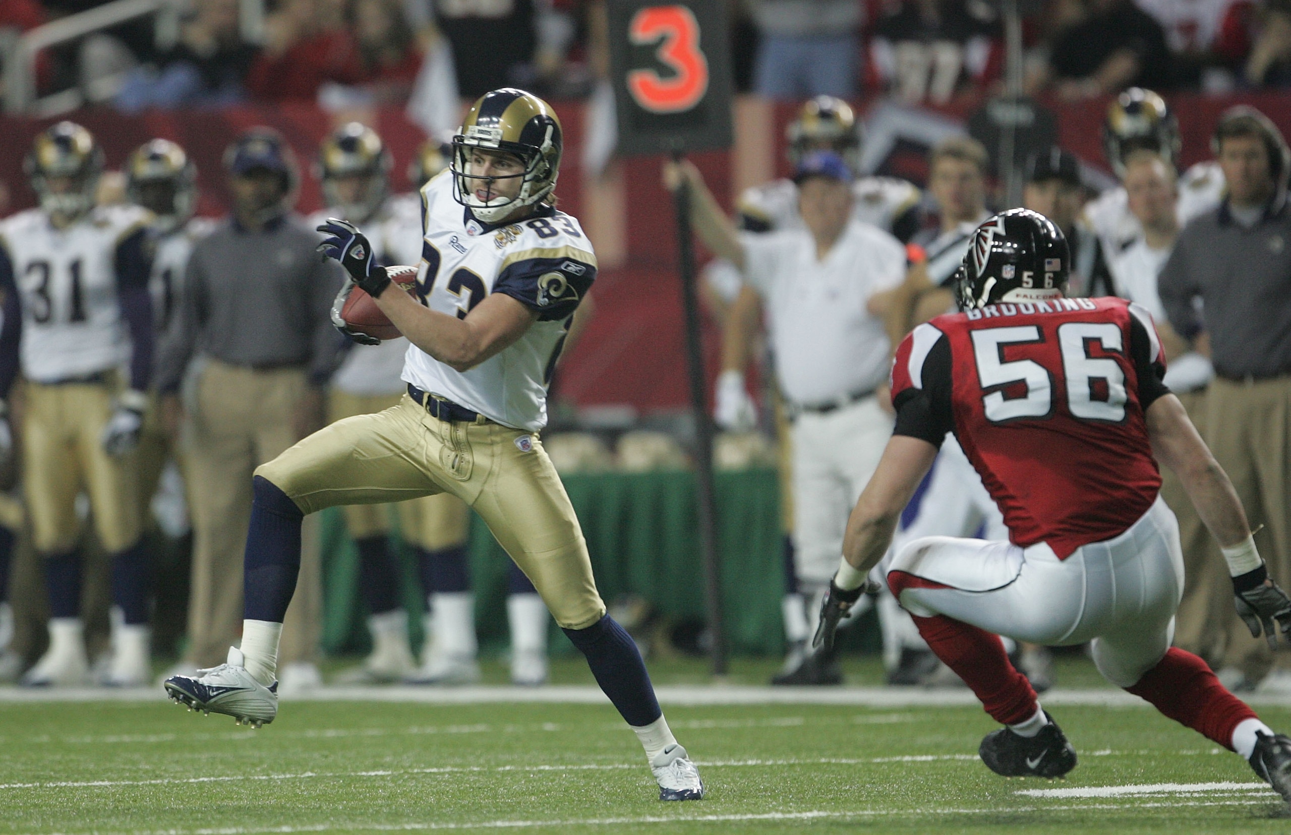 ATLANTA - JANUARY 15:  Kevin Curtis #83 of the St. Louis Rams runs against the Atlanta Falcons  during the NFC Divisional Playoff game at the Georgia Dome on January 15, 2005 in Atlanta, Georgia.  (Photo by Jeff Gross/Getty Images)
