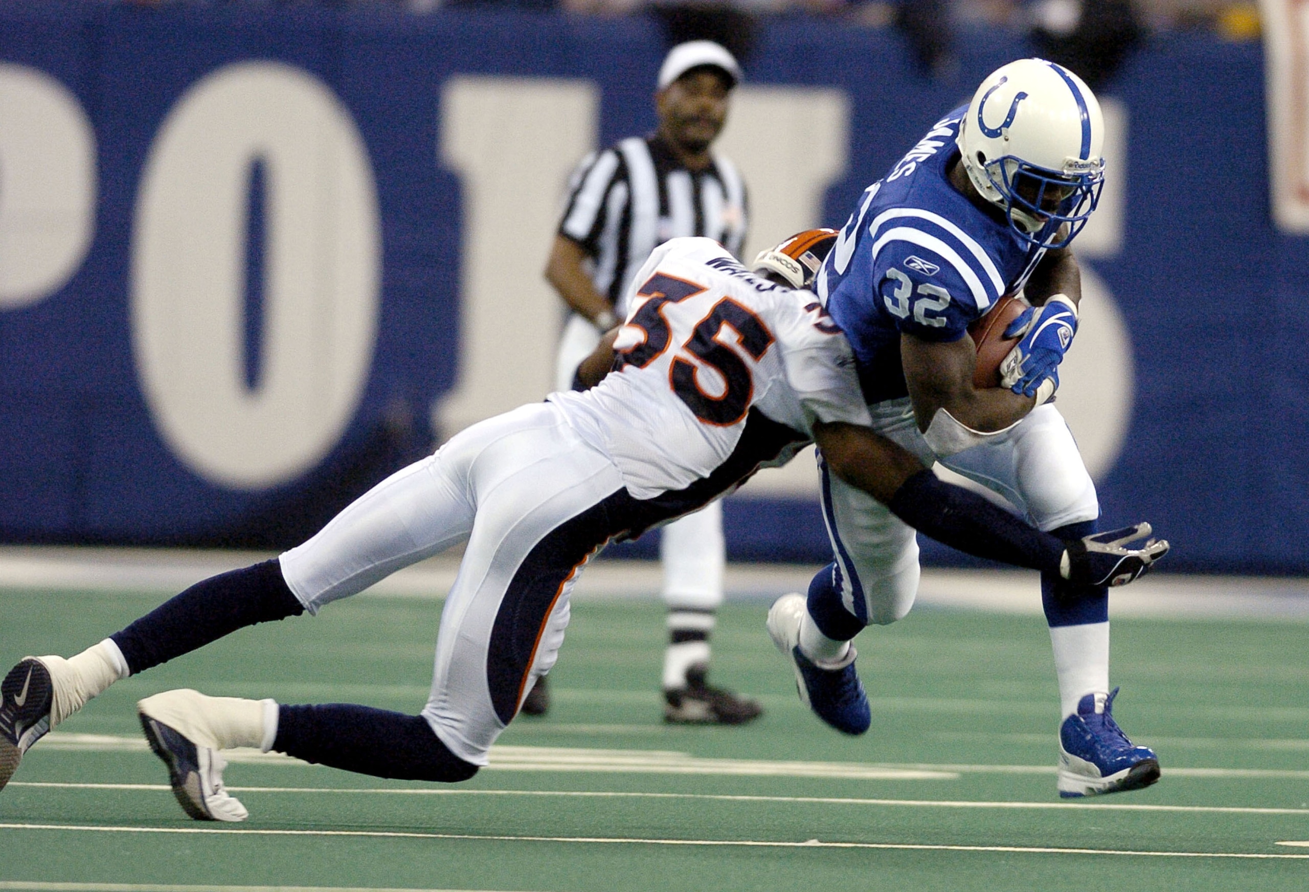 Indianapolis Colts running back Edgerrin James rambles for a gain at the RCA Dome, Indianapolis, Indiana, January 4, 2004 in an AFC wildcard playoff game.  The Colts defeated the  Denver Broncos 41 - 10.  (Photo by Al Messerschmidt/Getty Images)
