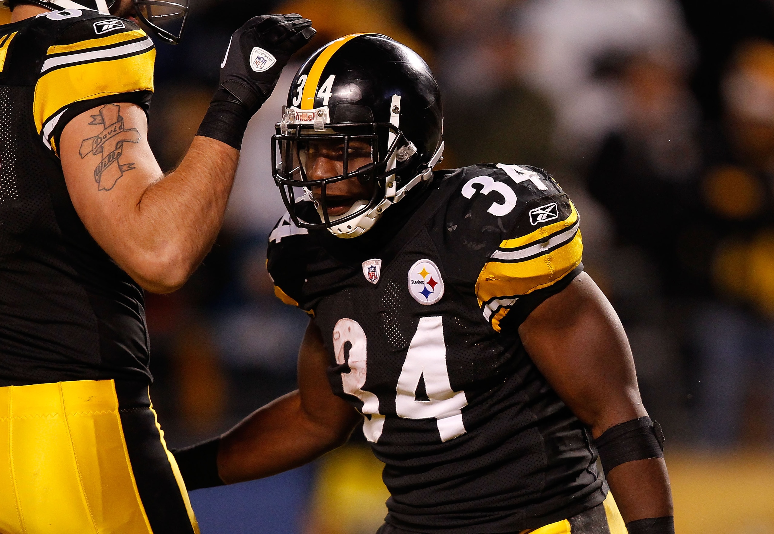 PITTSBURGH - DECEMBER 23:  Rashard Mendenhall #34 of the Pittsburgh Steelers celebrates with teammates after scoring a touchdown against the Carolina Panthers during the game on December 23, 2010 at Heinz Field in Pittsburgh, Pennsylvania.  (Photo by Jare