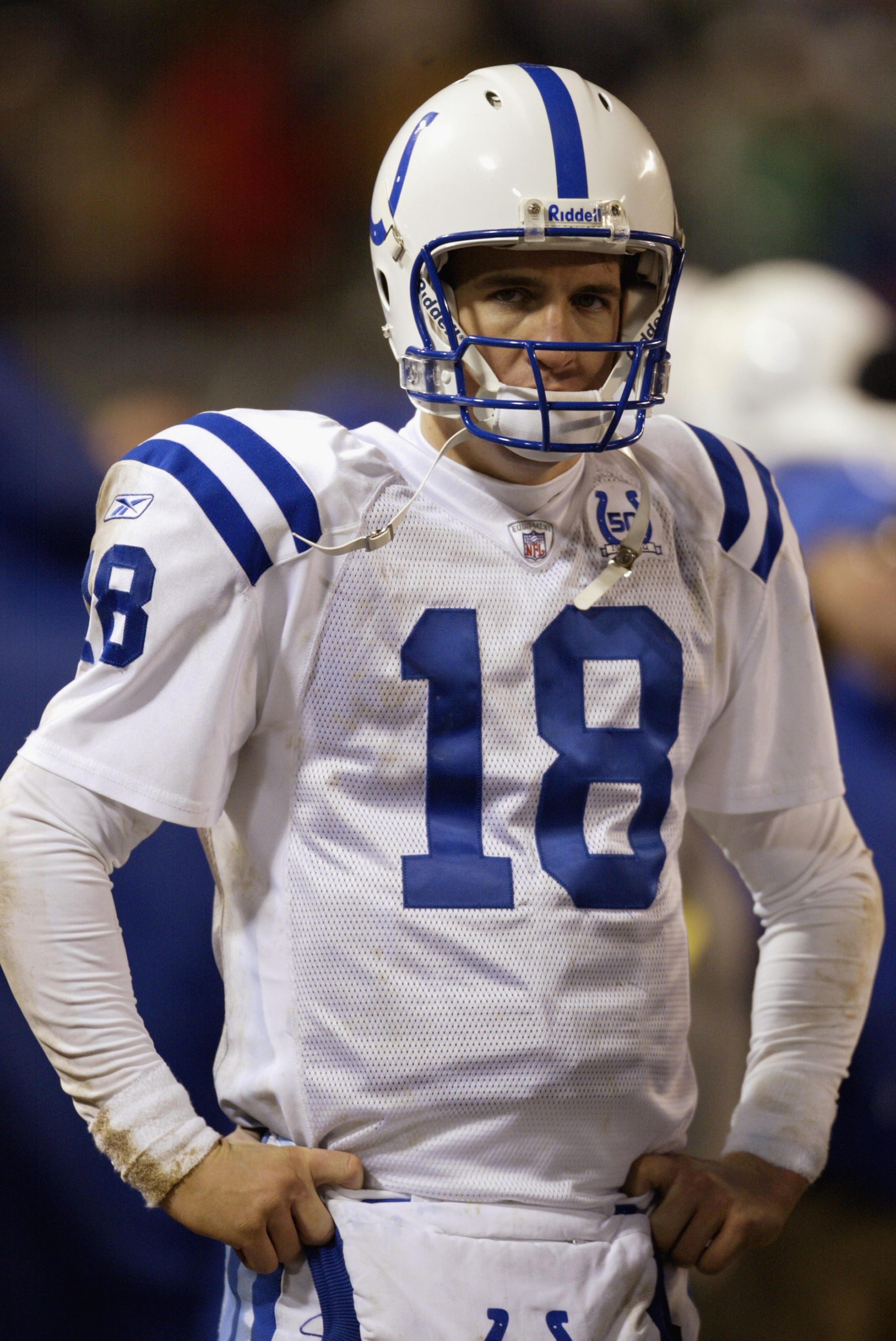 EAST RUTHERFORD, NJ - JANUARY 4:  Peyton Manning #18 of the Indianapolis Colts stands on the field during the AFC wildcard game against the New York Jets at Giants Stadium on January 4, 2003 in East Rutherford, New Jersey. The Jets won 41-0.  (Photo by Al