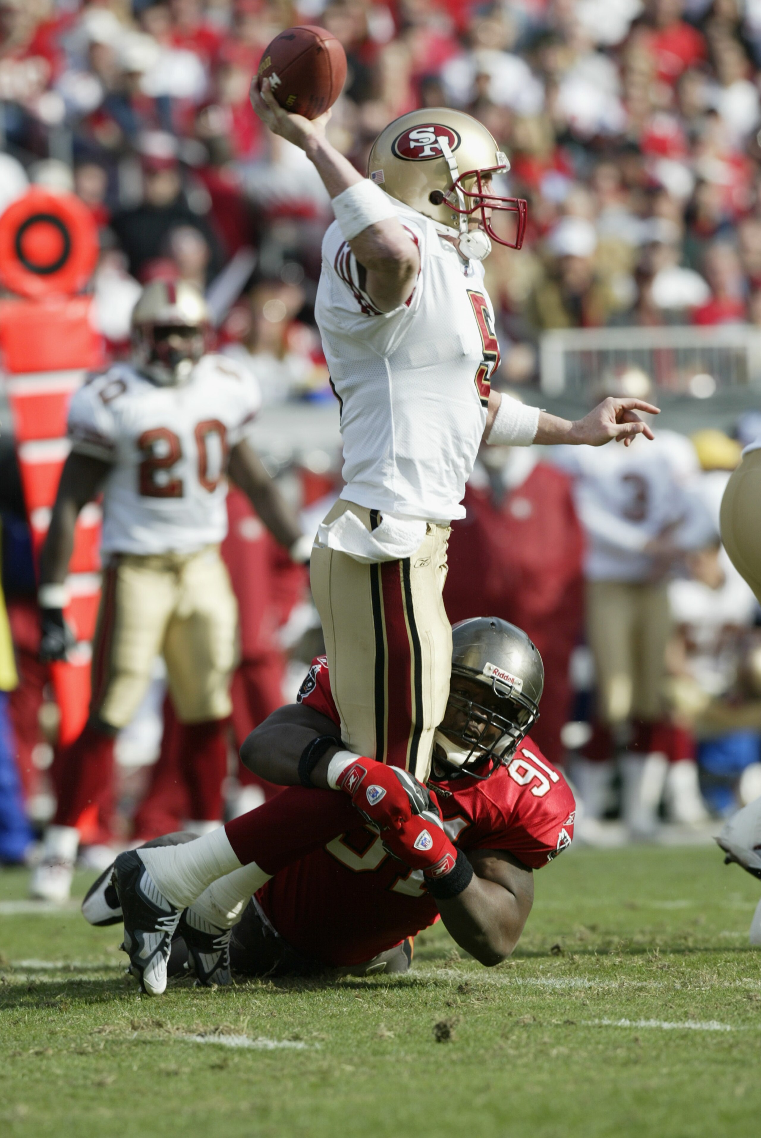 TAMPA, FL - JANUARY 12:  Quarterback Jeff Garcia #5 of the San Francisco 49ers gets hit by Chartric Darby #91 of the Tampa Bay Buccaneers in the NFC Divisional Playoff game at Raymond James Stadium on January 12, 2002 in Tampa, Florida. The Buccaneers def