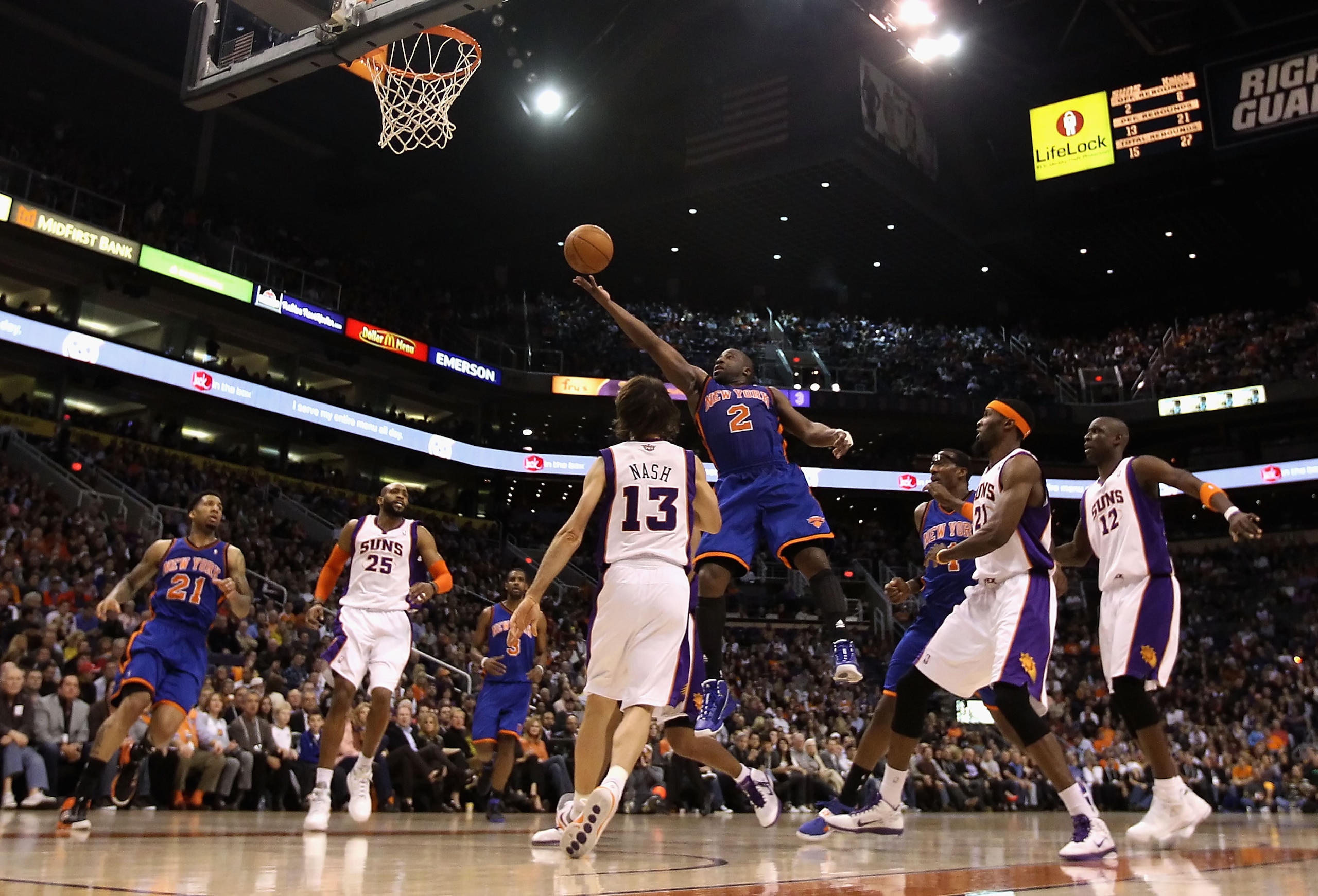 PHOENIX - JANUARY 07:  Raymond Felton #2 of the New York Knicks lays up a shot over Steve Nash #13 of the Phoenix Suns during the NBA game at US Airways Center on January 7, 2011 in Phoenix, Arizona.  The Knicks defeated the Suns 121-96.  NOTE TO USER: Us