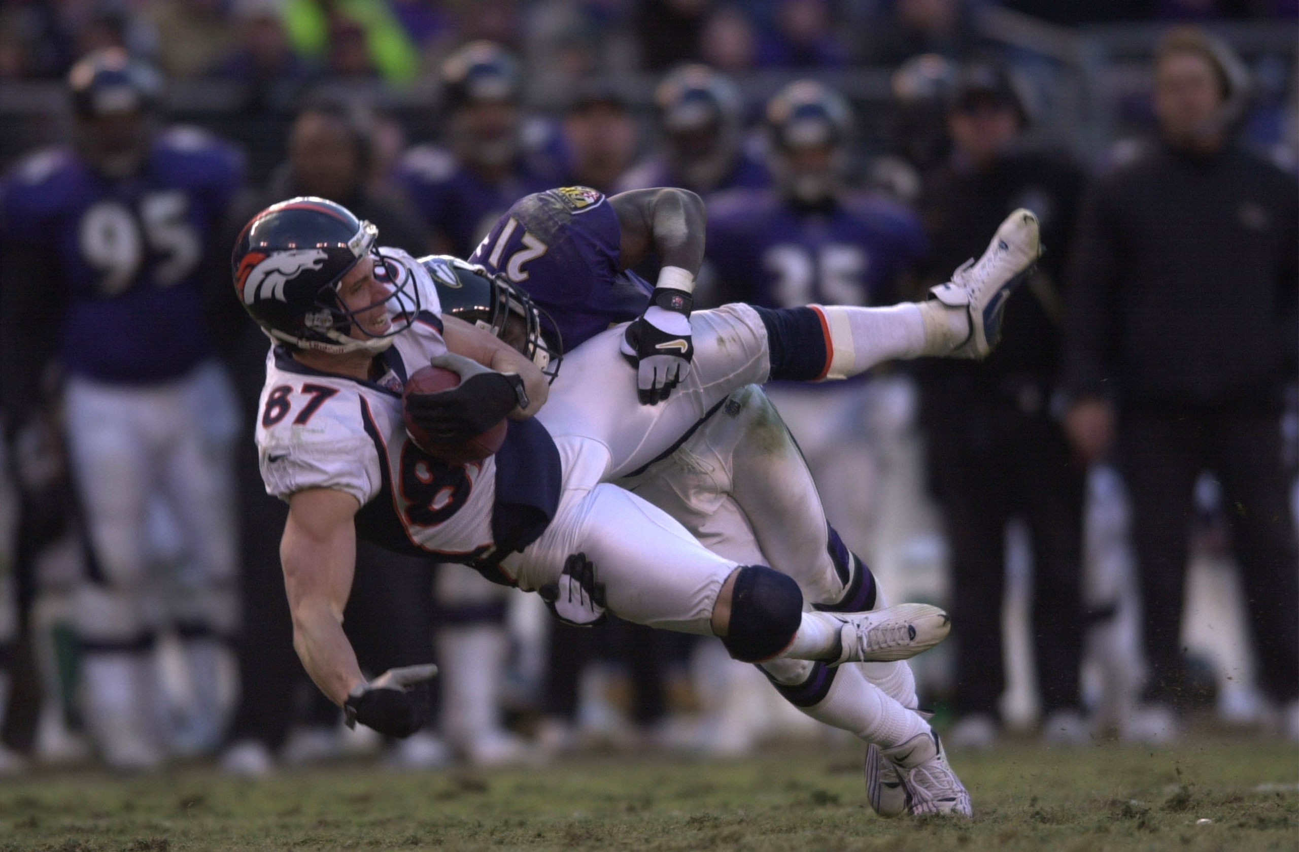 31 Dec 2000:  Ed McCaffery #87 of the Denver Broncos is tackled by Chris McAlister #21 of the Baltimore Ravens in the AFC Wildcard playoff game at PSINet Stadium in Baltimore, Maryland. The Ravens won 21-3. DIGITAL IMAGE Mandatory Credit: Doug Pensinger/A