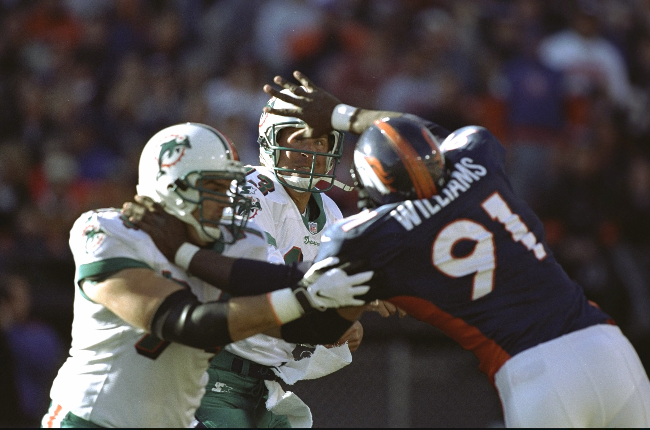 9 Jan 1999: Dan Marino #13 of the Miami Dolphins looks to throw during the AFC Play Offs against the  Denver Broncos at Mile High Stadium in Denver, Colorado. The Broncos defeated the Dolphins 38-3. Mandatory Credit: Brian Bahr  /Allsport