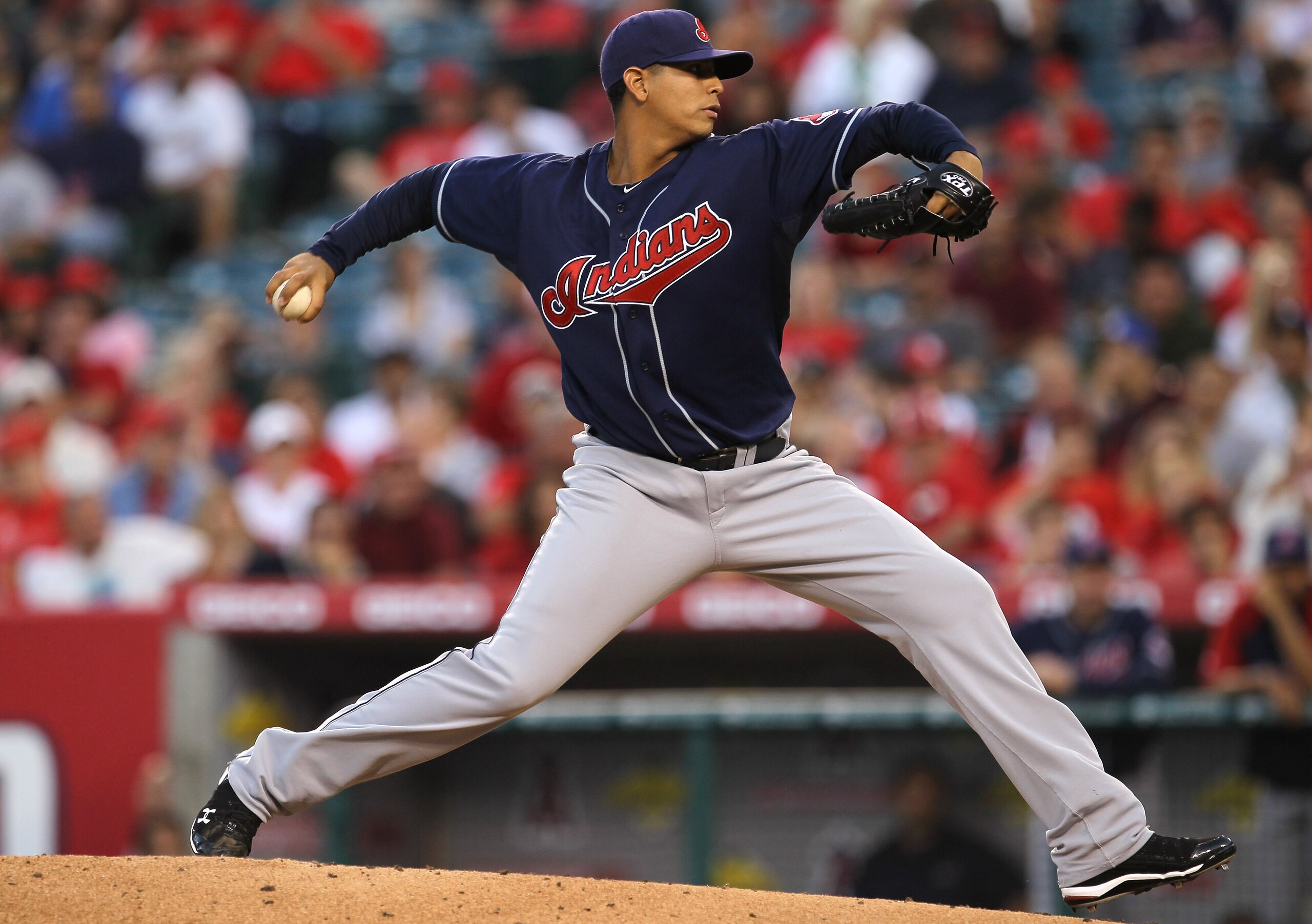 ANAHEIM, CA - SEPTEMBER 06:  Carlos Carrasco #59 of the Cleveland Indians throws a pitch against the Los Angeles Angels of Anaheim on September 6, 2010 at Angel Stadium in Anaheim, California.  (Photo by Stephen Dunn/Getty Images)