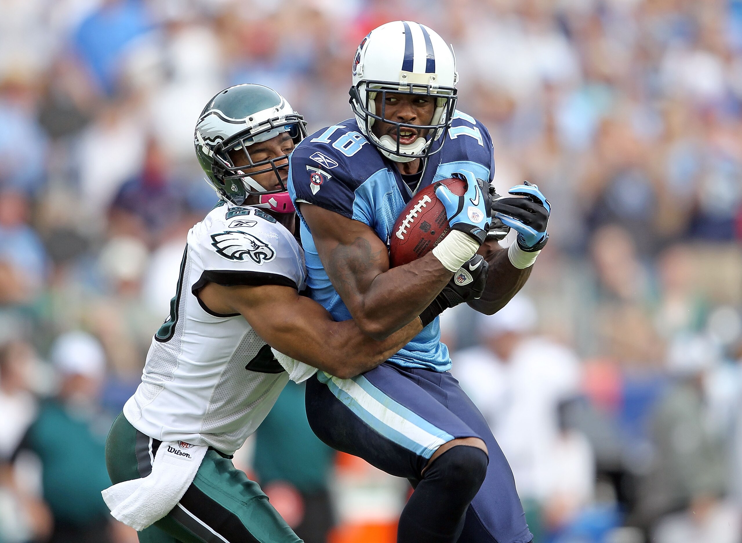 NASHVILLE, TN - OCTOBER 24:  Kenny Britt #18 of the Tennessee Titans catches a pass while defended by Nate Allen #29 of the Philadelphia Eagles during the NFL game at LP Field on October 24, 2010 in Nashville, Tennessee. The Titans won 37-19.  (Photo by A