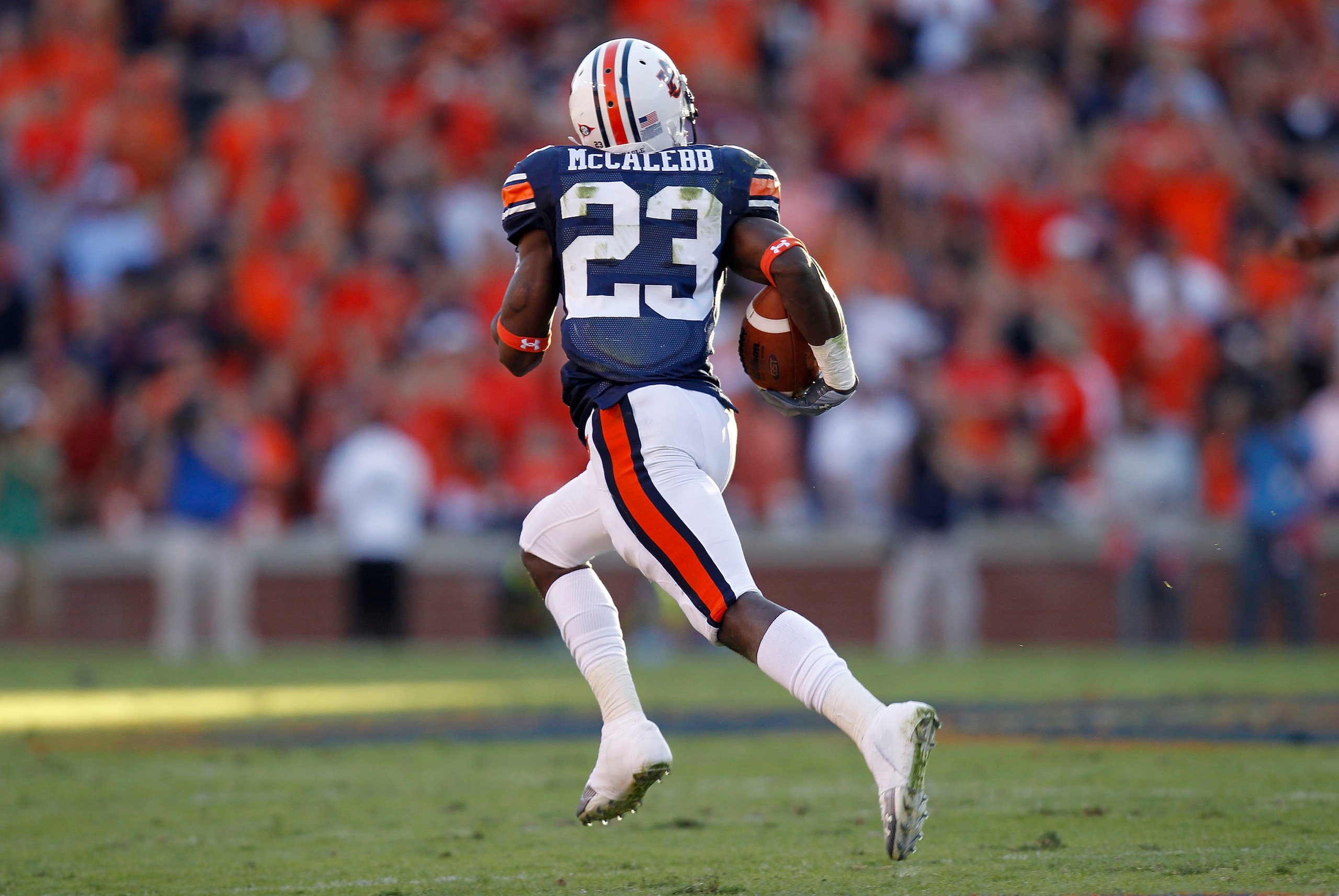 AUBURN - OCTOBER 16: Kick returner Onterio McCalebb of the Auburn Tigers runs for a 99 yard kick return during the game against the Arkansas Razorbacks at Jordan-Hare Stadium on October 16, 2010 in Auburn, Alabama. The Tigers beat the Razorbacks 65-43. AUBURN - OCTOBER 16: Kick returner Onterio McCalebb of the Auburn Tigers runs for a 99 yard kick return during the game against the Arkansas Razorbacks at Jordan-Hare Stadium on October 16, 2010 in Auburn, Alabama. The Tigers beat the Razorbacks 65-43.