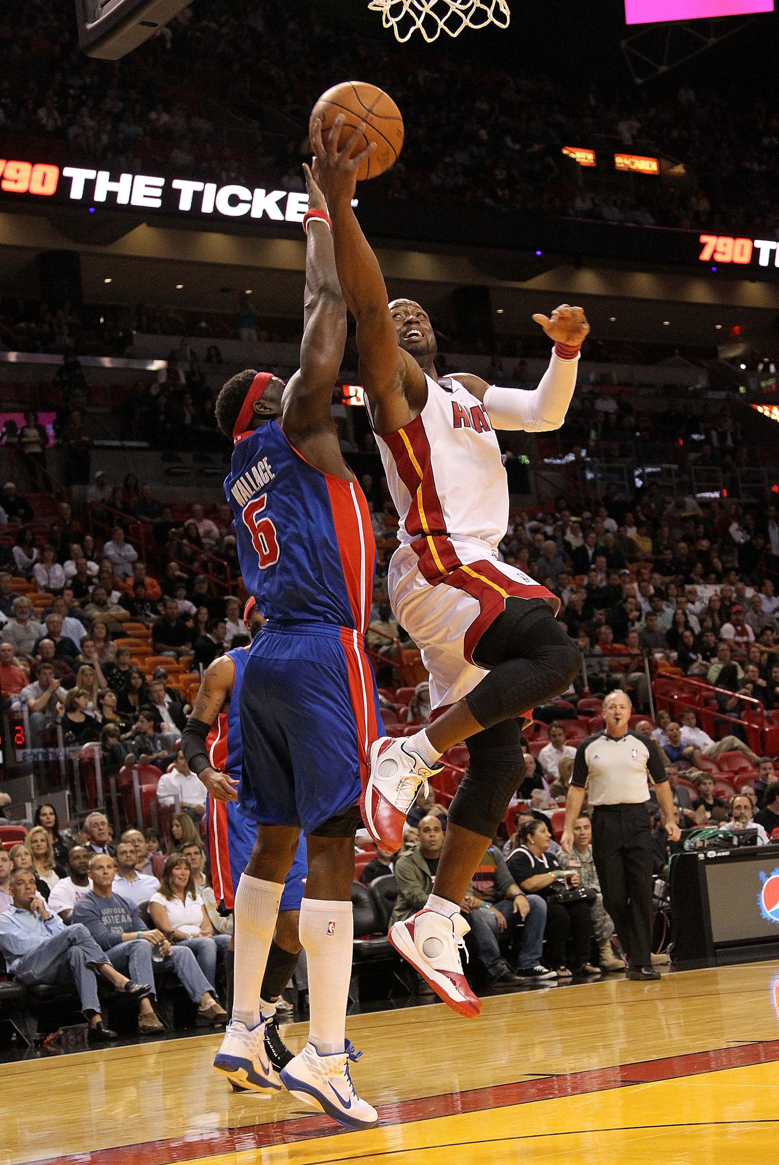 MIAMI, FL - DECEMBER 01:  Dwyane Wade #3 of the Miami Heat drives to the basket past Ben Wallace #6 of the Detroit Pistons during a game at American Airlines Arena on December 1, 2010 in Miami, Florida. NOTE TO USER: User expressly acknowledges and agrees