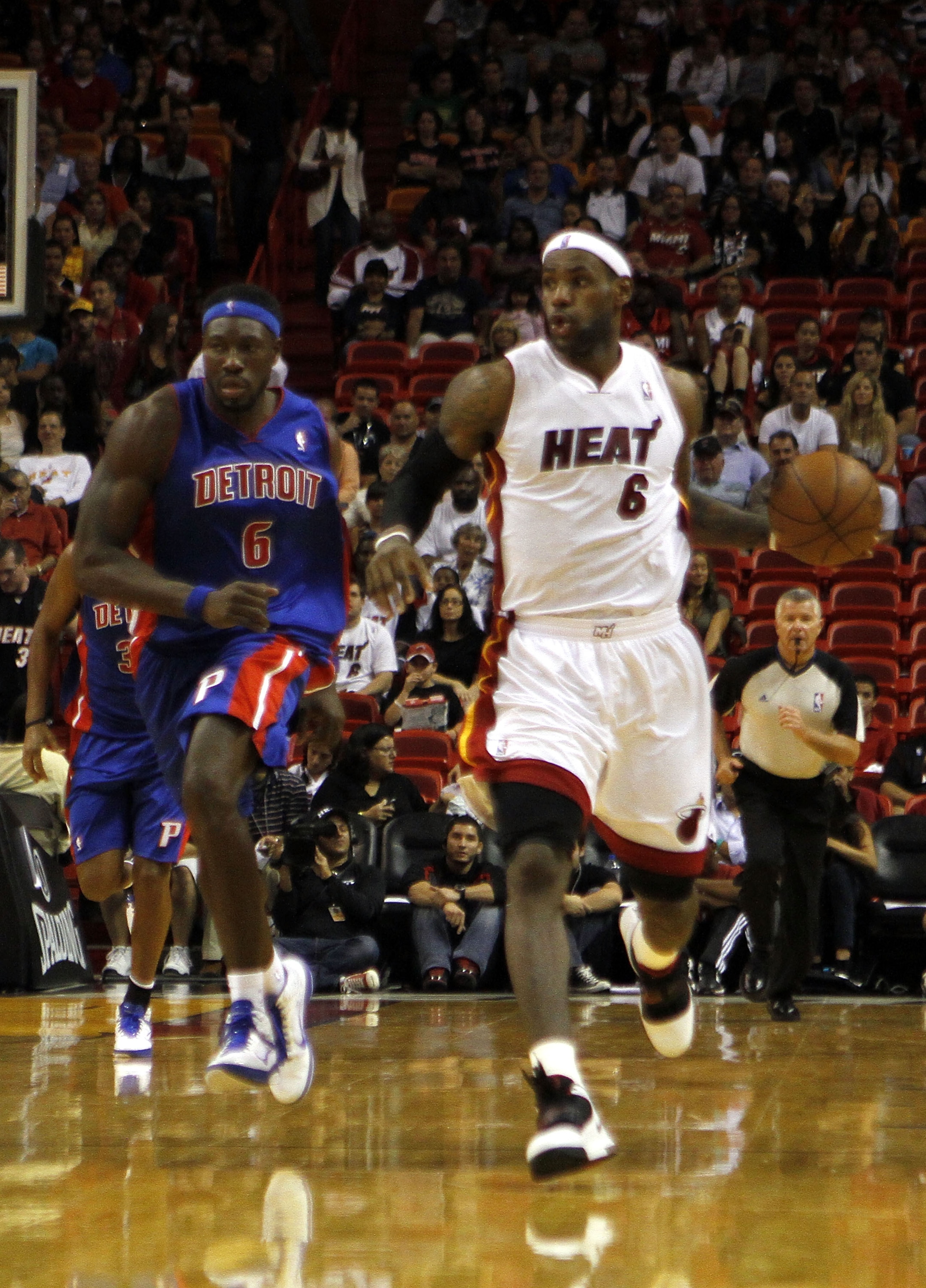 MIAMI - OCTOBER 05:  Forward LeBron James #6 drives against Ben Wallace #6 of the Detroit Pistons on October 5, 2010 in Miami, Florida.  NOTE TO USER: User expressly acknowledges and agrees that, by downloading and or using this photograph, User is consen