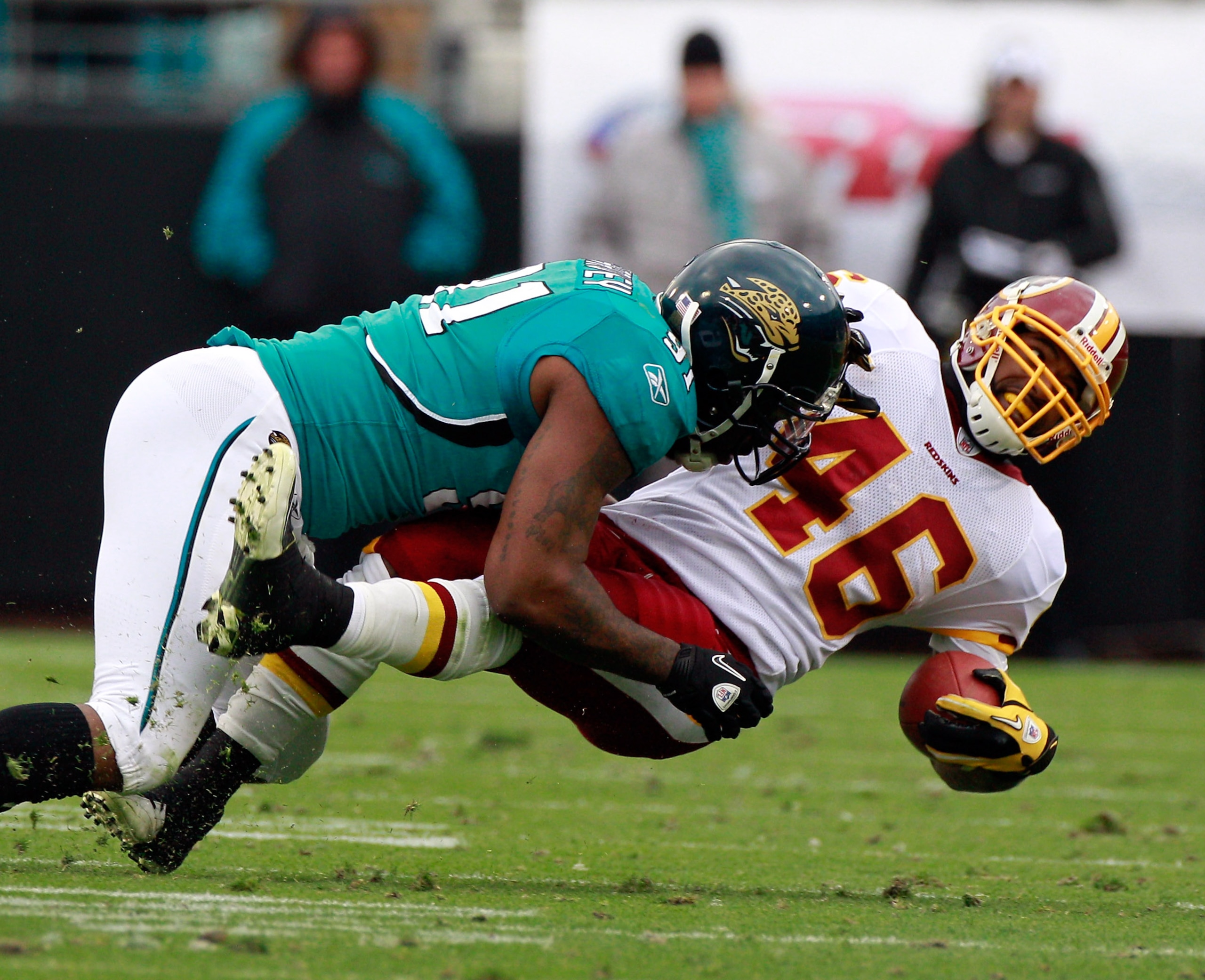 JACKSONVILLE, FL - DECEMBER 26:   Ryan Torain #46 of the Washington Redskins is tackled by Derrick Harvey #91 of the Jacksonville Jaguars during the game at EverBank Field on December 26, 2010 in Jacksonville, Florida.  (Photo by Sam Greenwood/Getty Image