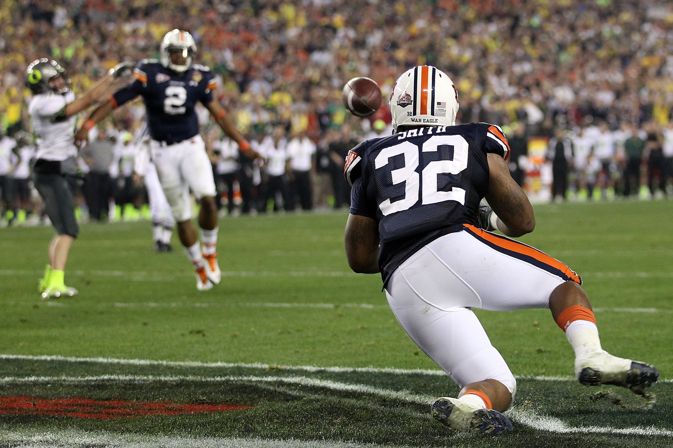 GLENDALE, AZ - JANUARY 10: Eric Smith #32 of the Auburn Tigers is unable to come up with a fourth down pass from quarterback Cameron Newton #2 in the second quarter against the Oregon Ducks during the Tostitos BCS National Championship Game at University GLENDALE, AZ - JANUARY 10: Eric Smith #32 of the Auburn Tigers is unable to come up with a fourth down pass from quarterback Cameron Newton #2 in the second quarter against the Oregon Ducks during the Tostitos BCS National Championship Game at University