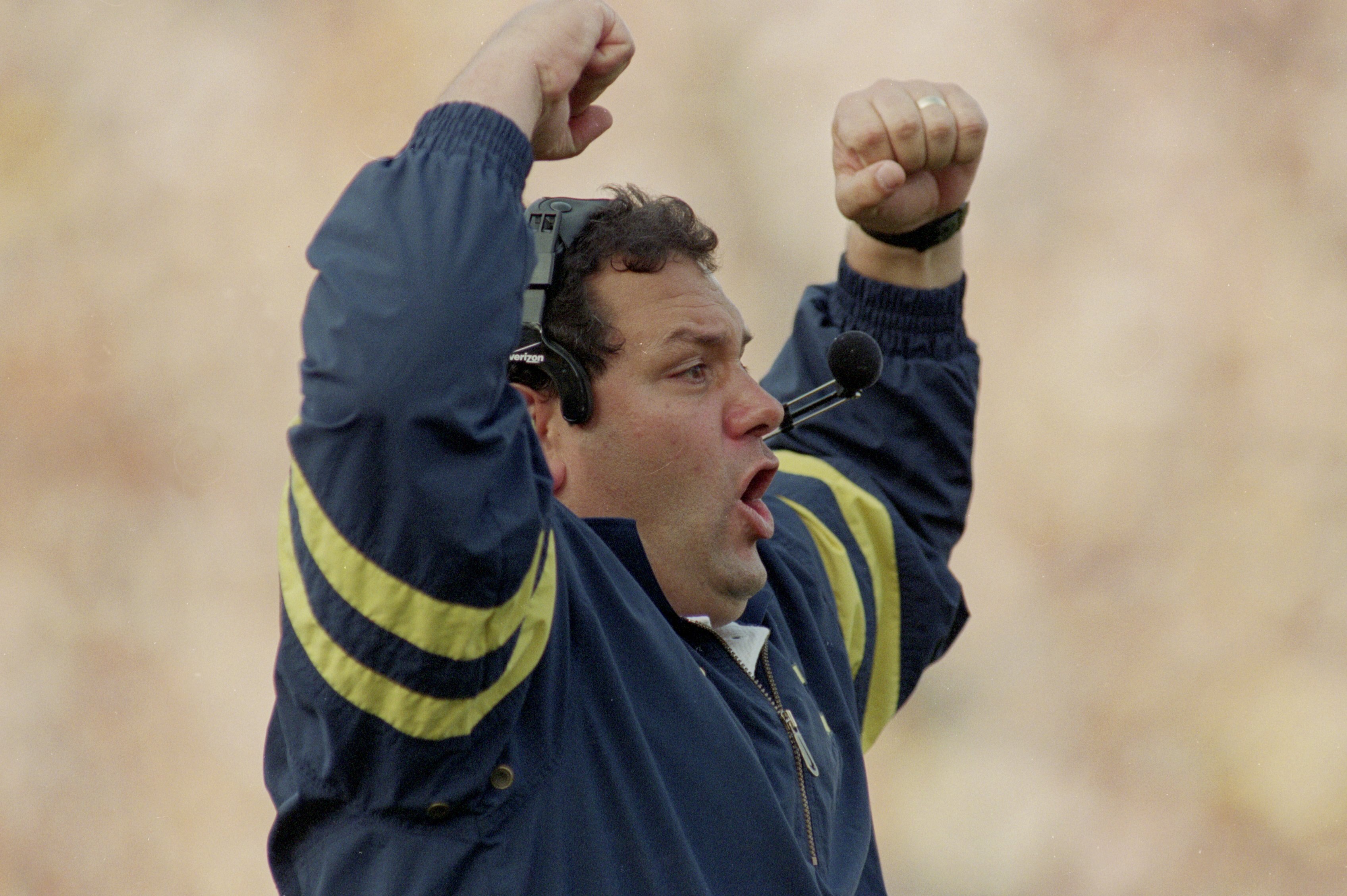 21 Oct 2000: Defensive Line Coach Brady Hoke of the Michigan Wolverines cheers on the sidelines during the game against the Michigan State Spartans at the Michigan Stadium in Ann Arbor, Michigan.  The Wolverines defeated the Spartans 16-0.Mandatory Credit