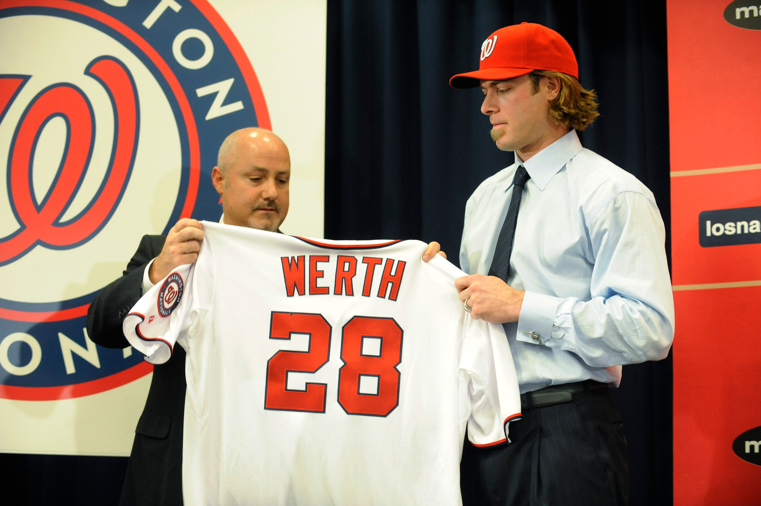 WASHINGTON, DC - DECEMBER 15:  Executive Vice President of Baseball Operations and General Manager Mike Rizzo (L) introduces Jayson Werth #28  to the media on December 15, 2010 at Nationals Park in Washington, DC.   (Photo by Mitchell Layton/Getty Images)