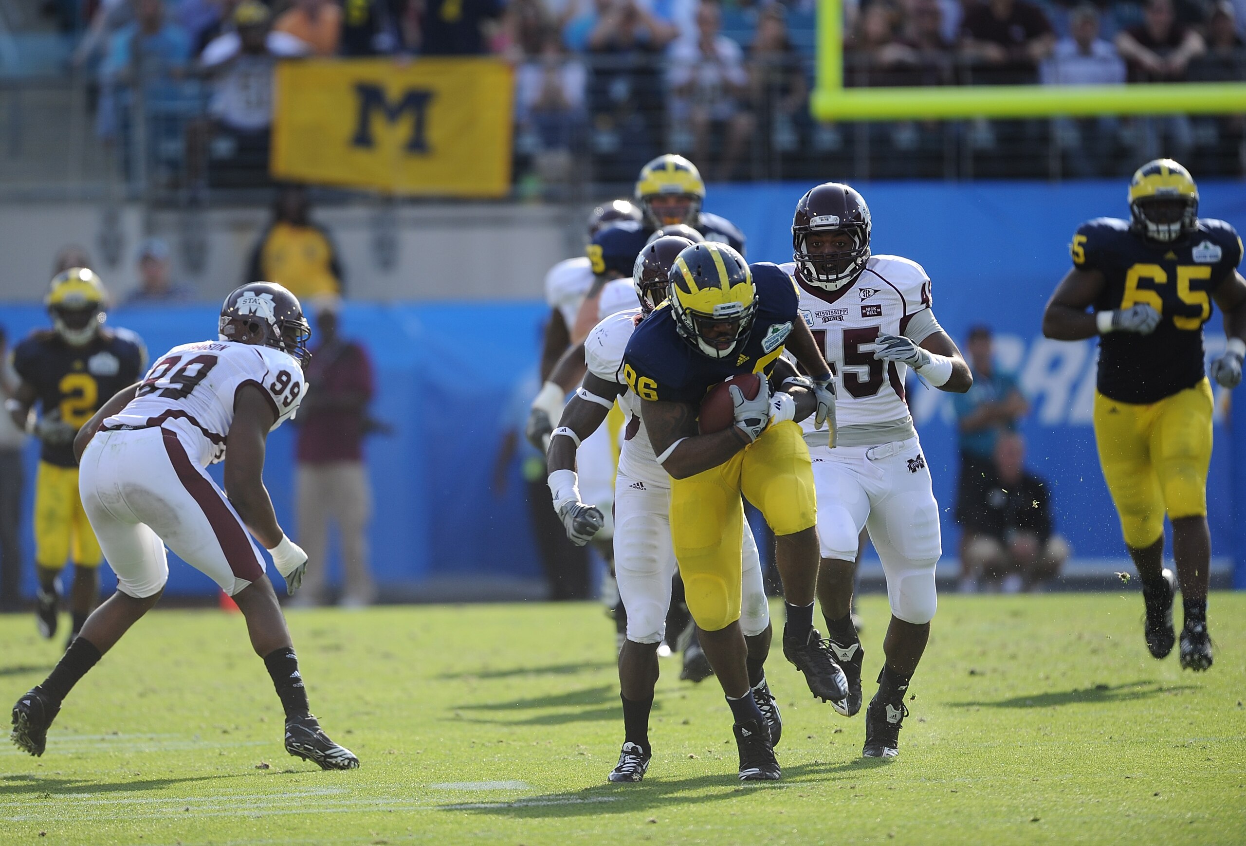 JACKSONVILLE, FL - JANUARY 01:  Kevin Koger #86 of the Michigan Wolverines breaks tackles following a reception against the Mississippi State Bulldogs during the Gator Bowl at EverBank Field on January 1, 2011 in Jacksonville, Florida  (Photo by Rick Dole