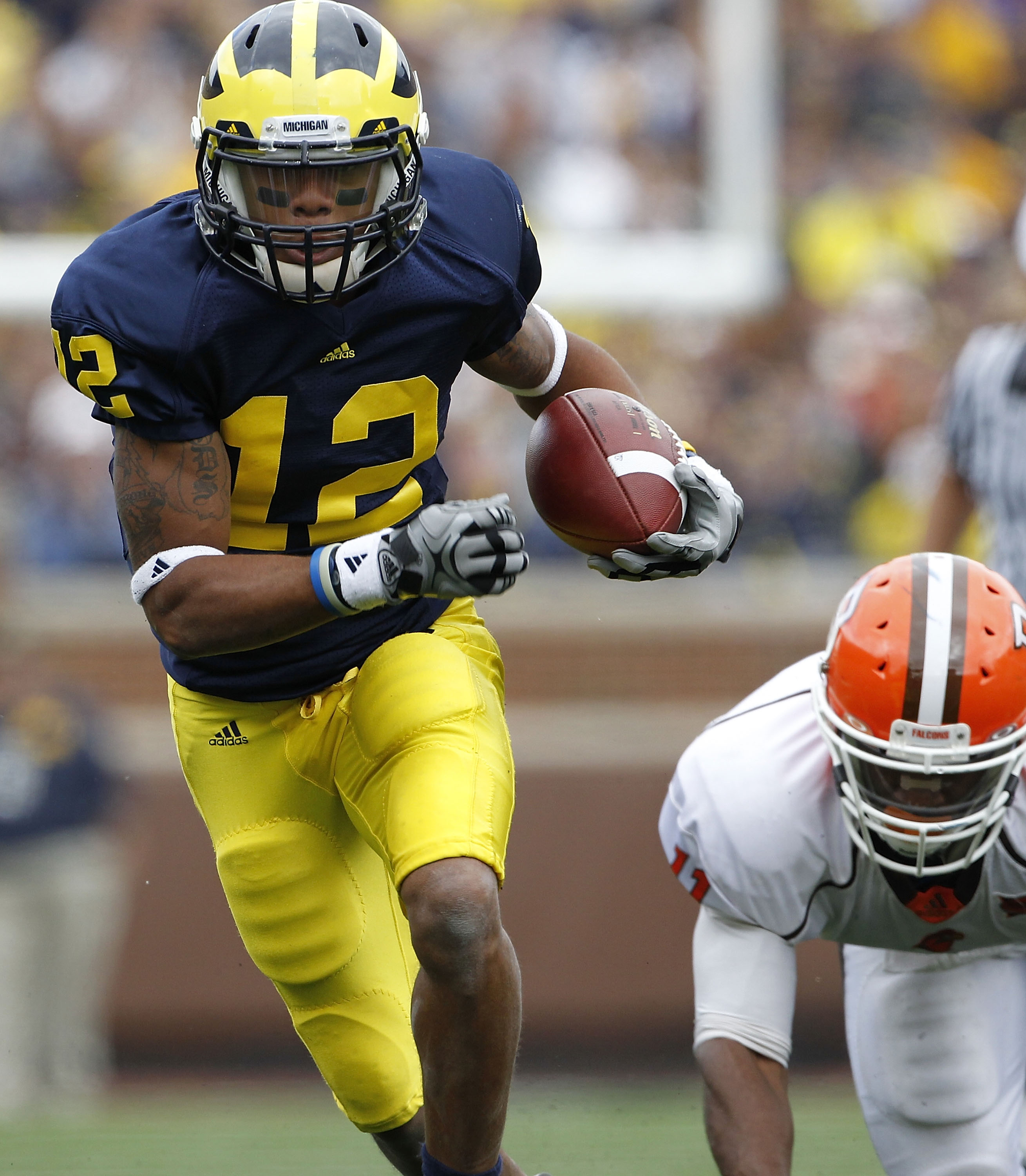 ANN ARBOR, MI - SEPTEMBER 25: Roy Roundtree #12 of the Michigan Wolverines runs for a 32 yard gain after catching the pass from Denard Robinson during the first quarter of the game against Bowling Green on September 25, 2010 at Michigan Stadium in Ann Arb