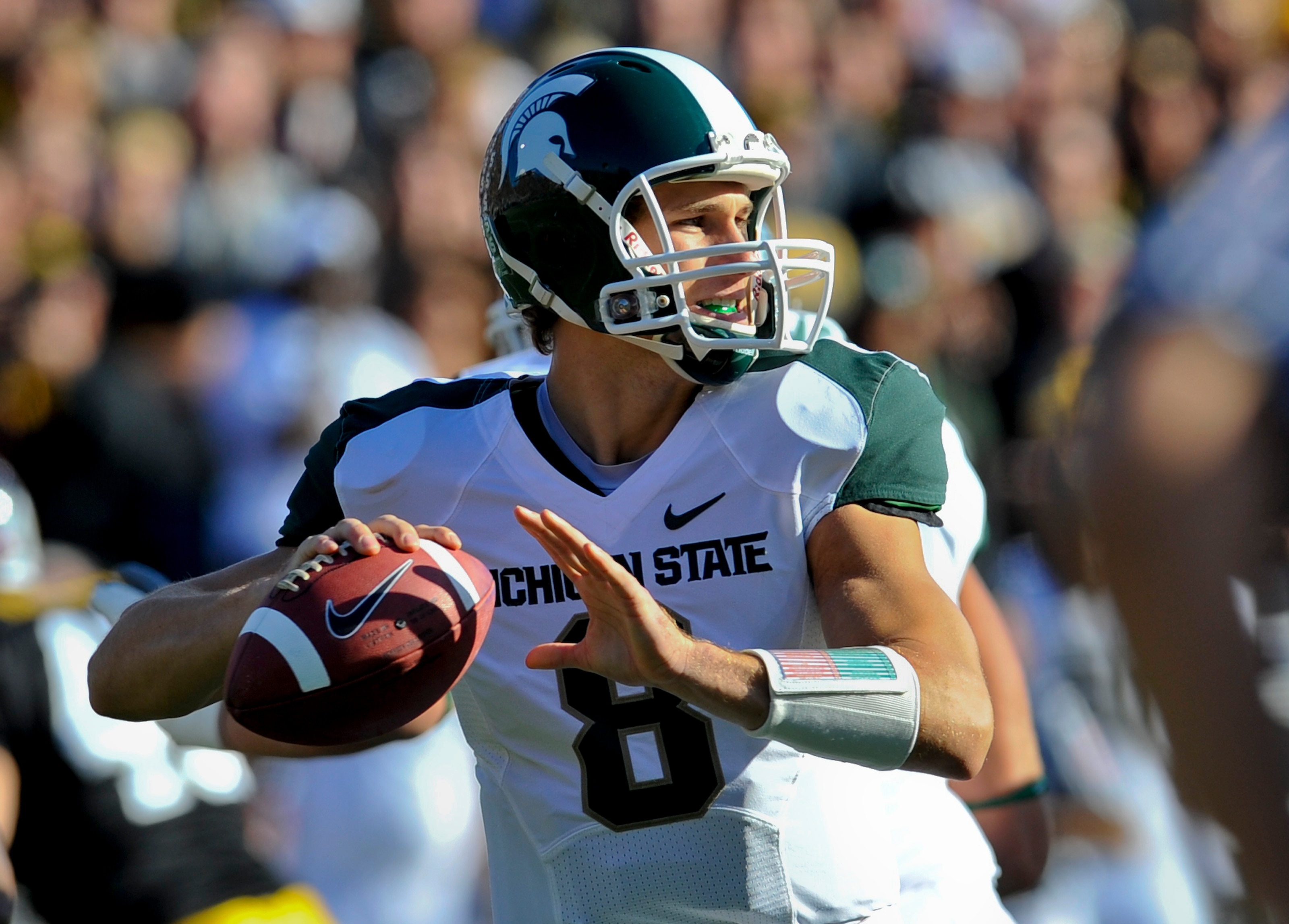 IOWA CITY, IA - OCTOBER 30- Quarterback Kirk Cousins #8 of the Michigan State Spartans looks down field for a receiver during play against the University of Iowa Hawkeyes at Kinnick Stadium on October 30, 2010 in Iowa City, Iowa. Iowa won 37-6 over Michig