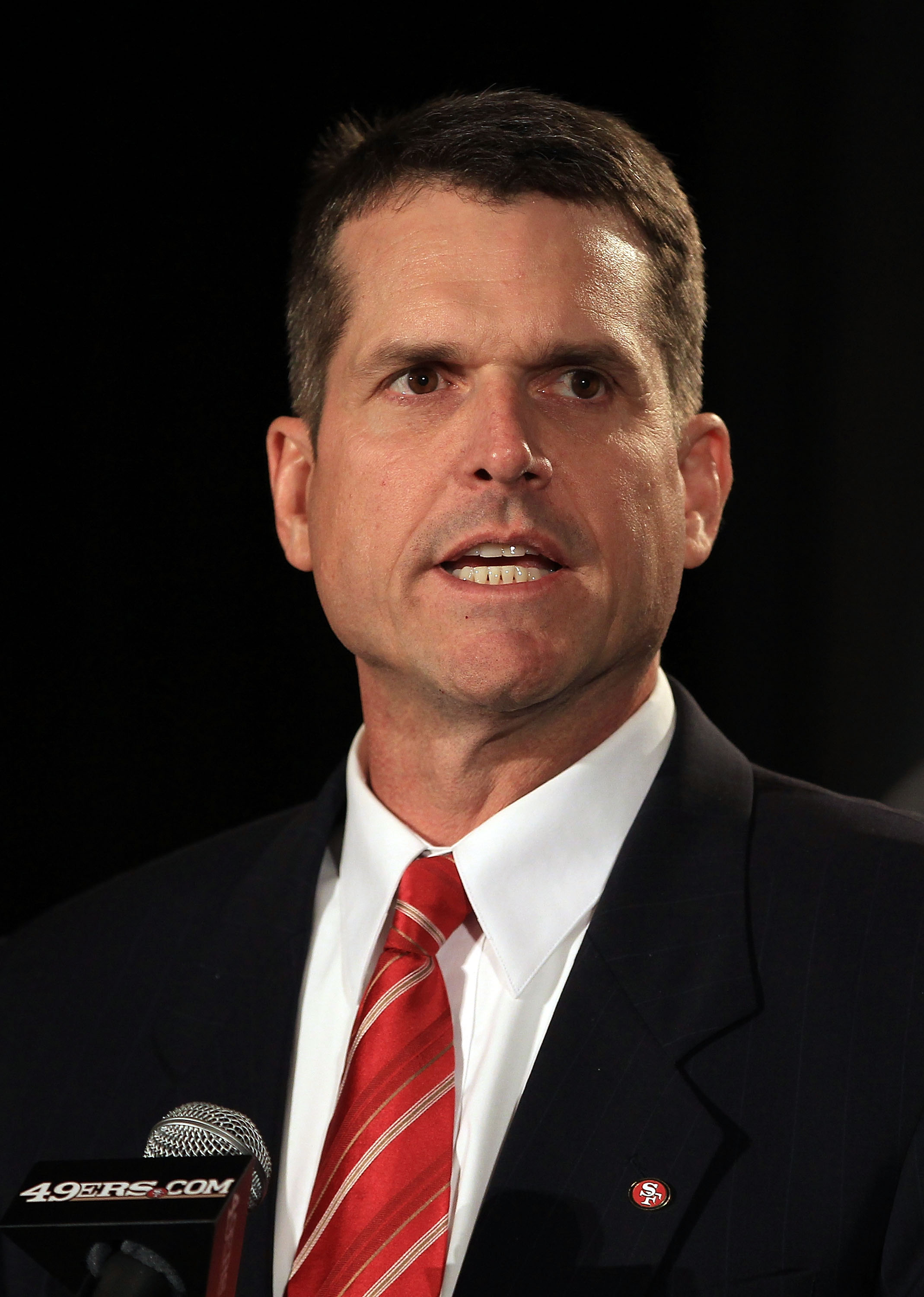 SAN FRANCISCO, CA - JANUARY 07:  Jim Harbaugh speaks at a press conference where he was introduced as the new San Francisco 49ers head coach at the Palace Hotel on January 7, 2011 in San Francisco, California.  (Photo by Ezra Shaw/Getty Images)