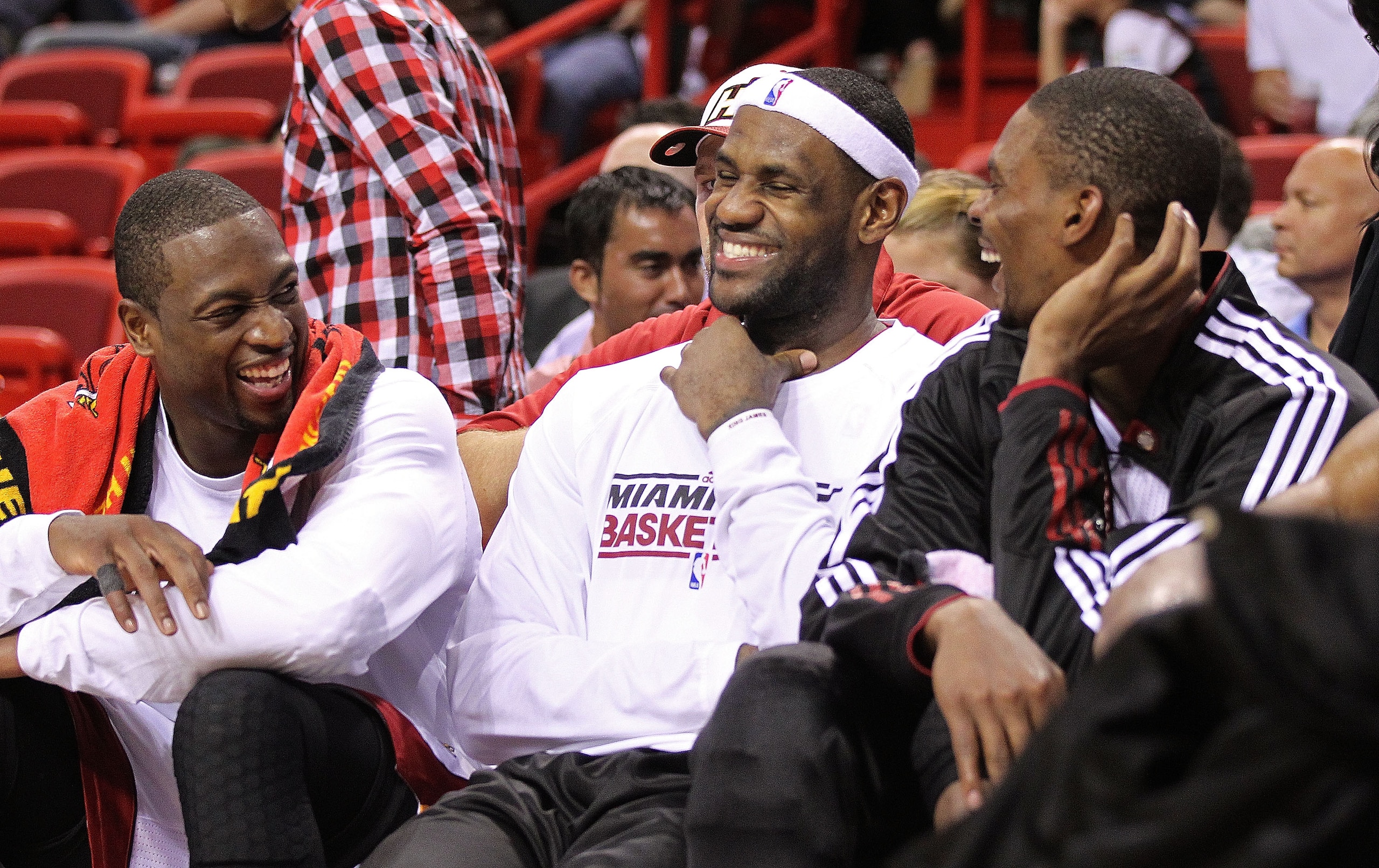 MIAMI - NOVEMBER 17:  LeBron James #6 and Dwyane Wade #3, and Chris Bosh #1 of the Miami Heat laugh on the bench during a game against the Phoenix Suns at American Airlines Arena on November 17, 2010 in Miami, Florida. NOTE TO USER: User expressly acknowl