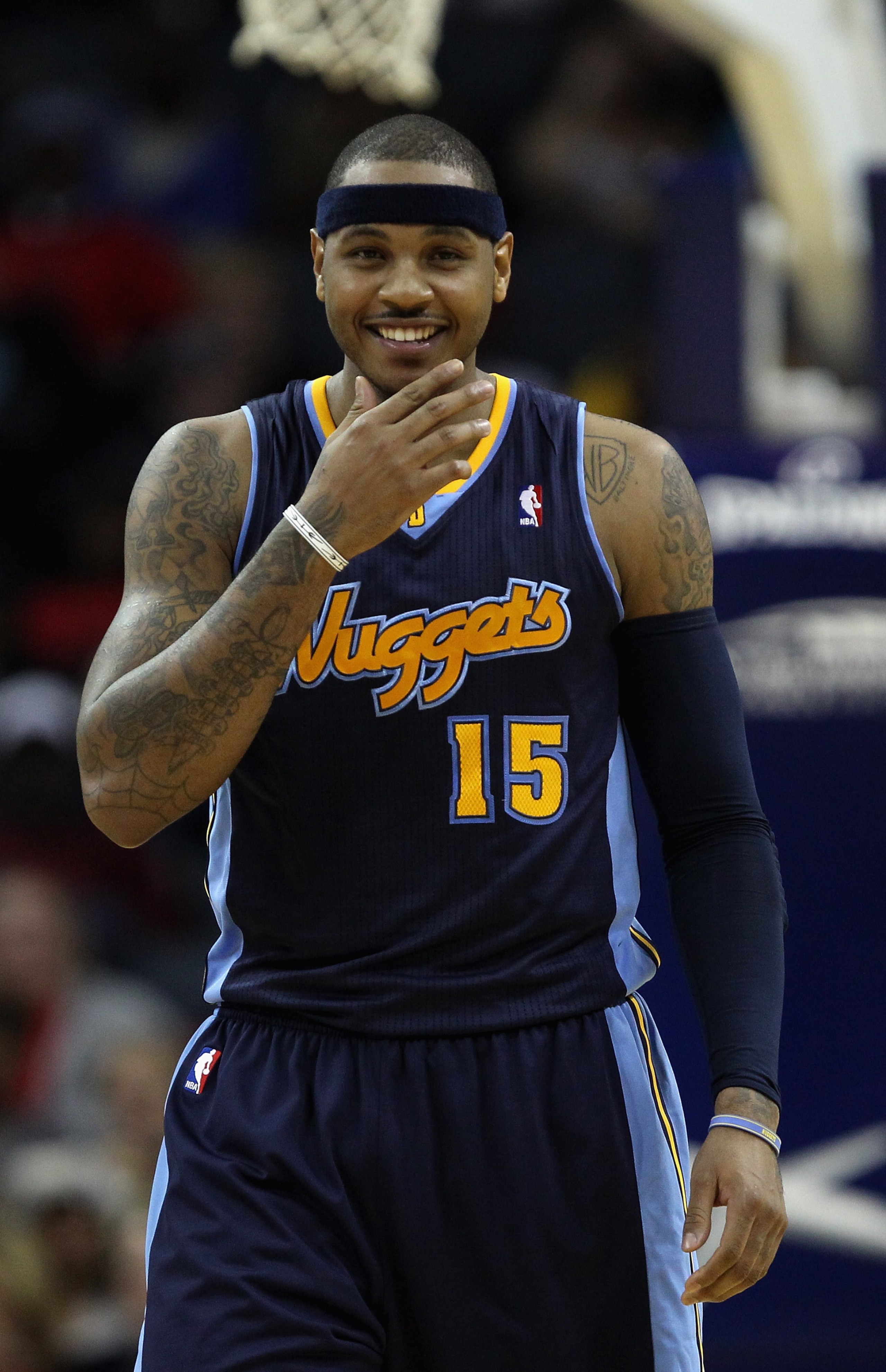 CHARLOTTE, NC - DECEMBER 07:  Carmelo Anthony #15 of the Denver Nuggets watches on against the Charlotte Bobcats during their game at Time Warner Cable Arena on December 7, 2010 in Charlotte, North Carolina.  NOTE TO USER: User expressly acknowledges and