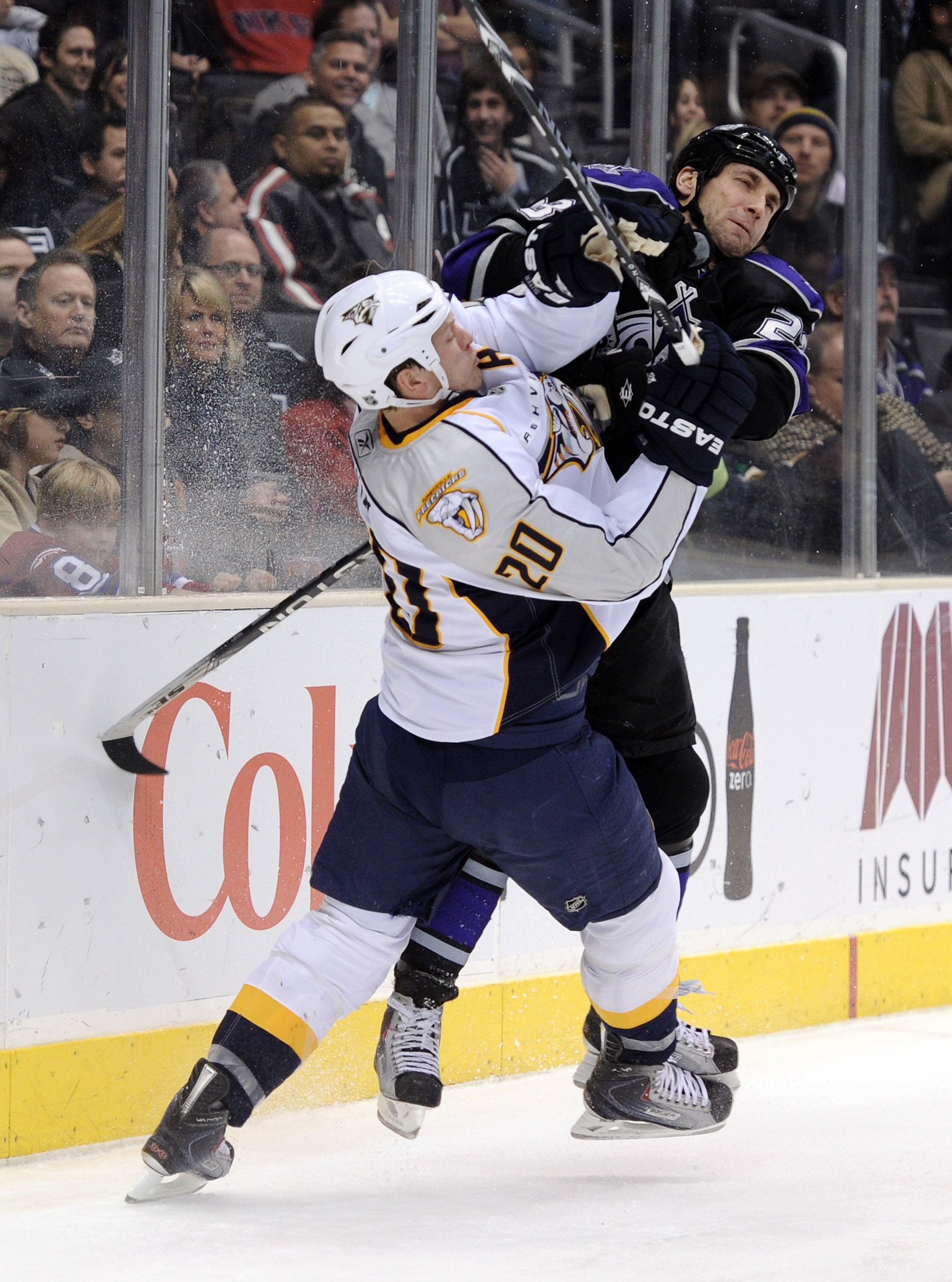 LOS ANGELES, CA - JANUARY 06:  Jarret Stoll #28 of the Los Angeles Kings puts a check on Ryan Suter #20 of the Nashville Predators during the second period at the Staples Center on January 6, 2011 in Los Angeles, California.  (Photo by Harry How/Getty Ima