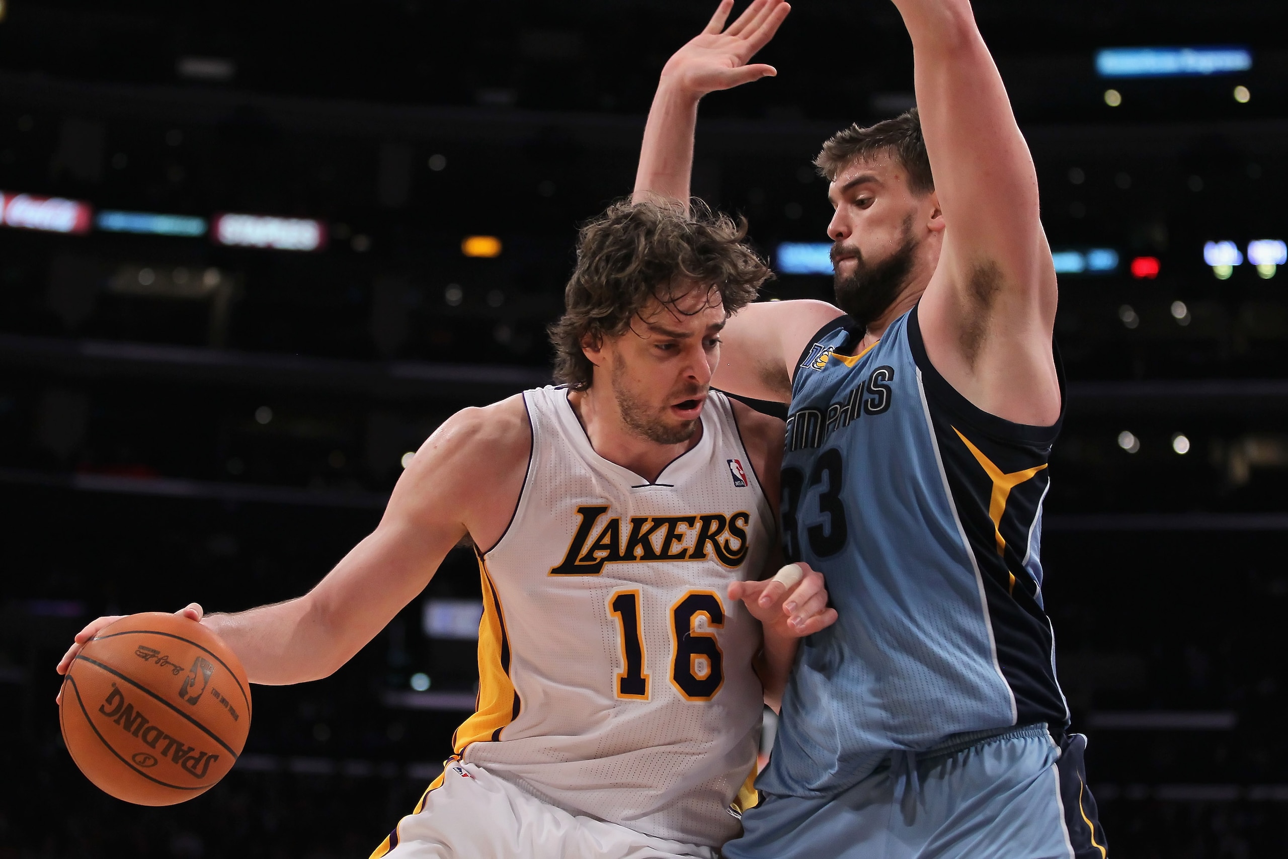 LOS ANGELES, CA - JANUARY 02:  Pau Gasol #16 of the Los Angeles Lakers is defended by Marc Gasol #33 of the Memphis Grizzlies during the second half at Staples Center on January 2, 2011 in Los Angeles, California. The Grizzlies defeated the Lakers 104-85.