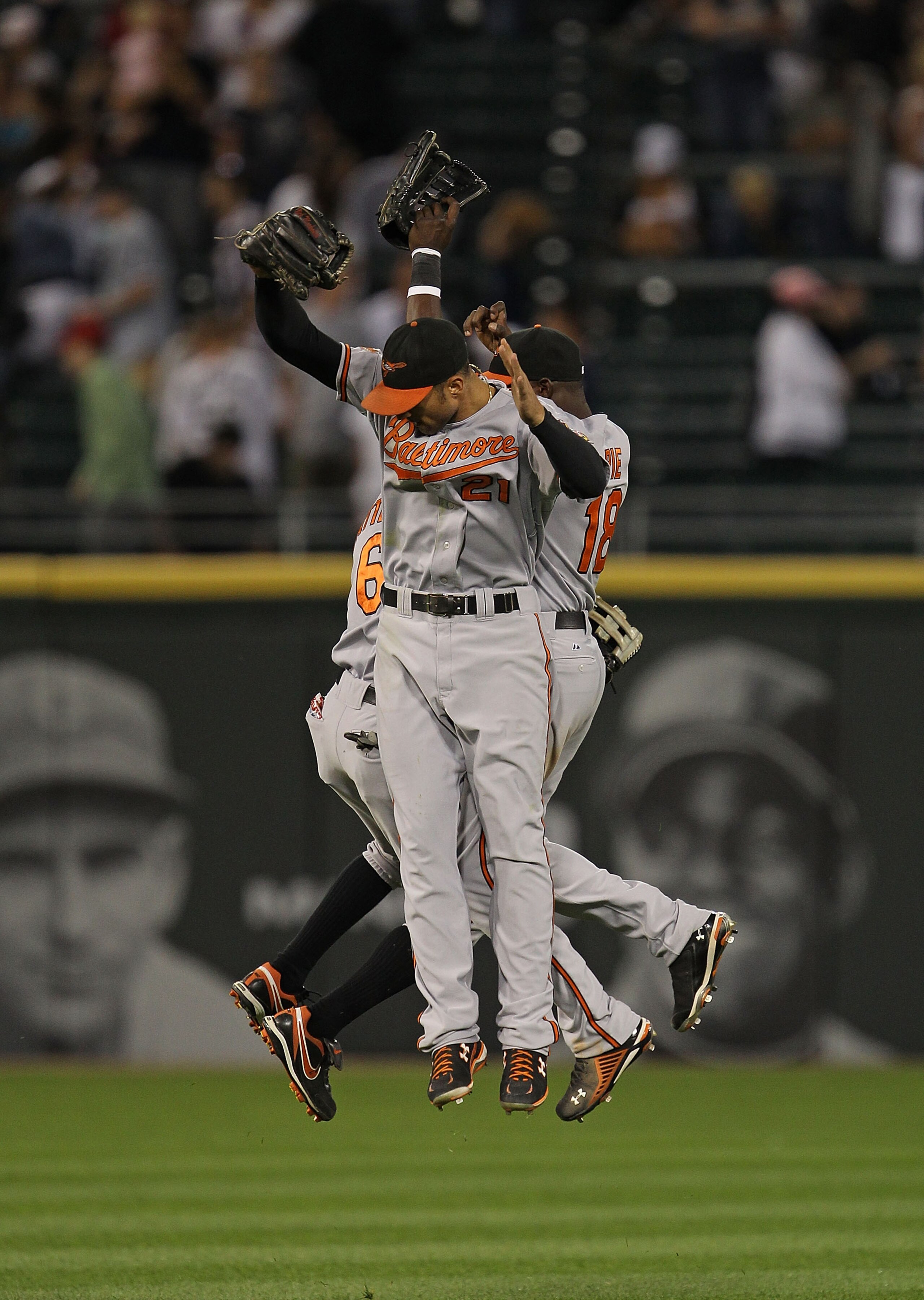 CHICAGO - AUGUST 25: (L-R) Cory Patterson #6, Nick Markakis #21 and Felix Pie #18 of the Baltimore Orioles leap in celebration after a win over the Chicago White Sox at U.S. Cellular Field on August 25, 2010 in Chicago, Illinois. The Orioles defeated the CHICAGO - AUGUST 25: (L-R) Cory Patterson #6, Nick Markakis #21 and Felix Pie #18 of the Baltimore Orioles leap in celebration after a win over the Chicago White Sox at U.S. Cellular Field on August 25, 2010 in Chicago, Illinois. The Orioles defeated the