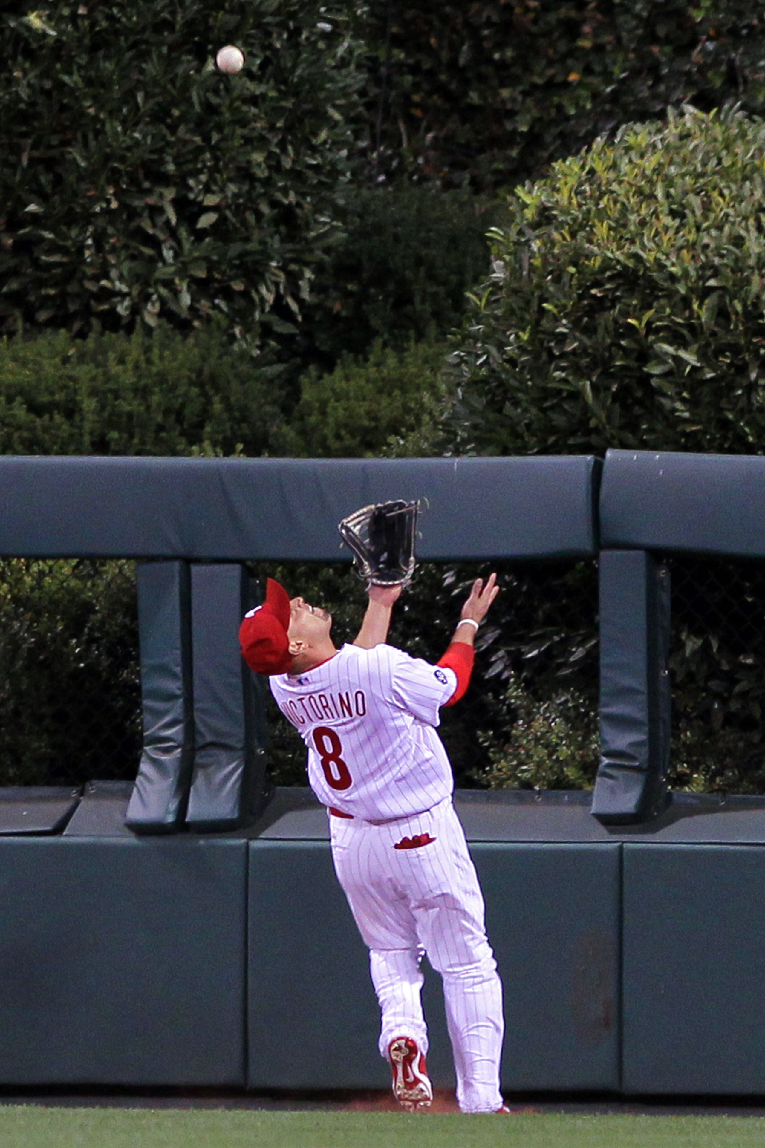PHILADELPHIA - OCTOBER 23: Shane Victorino #8 of the Philadelphia Phillies chases down a fly ball in centerfiled against the San Francisco Giants in Game Six of the NLCS during the 2010 MLB Playoffs at Citizens Bank Park on October 23, 2010 in Philadelph PHILADELPHIA - OCTOBER 23: Shane Victorino #8 of the Philadelphia Phillies chases down a fly ball in centerfiled against the San Francisco Giants in Game Six of the NLCS during the 2010 MLB Playoffs at Citizens Bank Park on October 23, 2010 in Philadelph