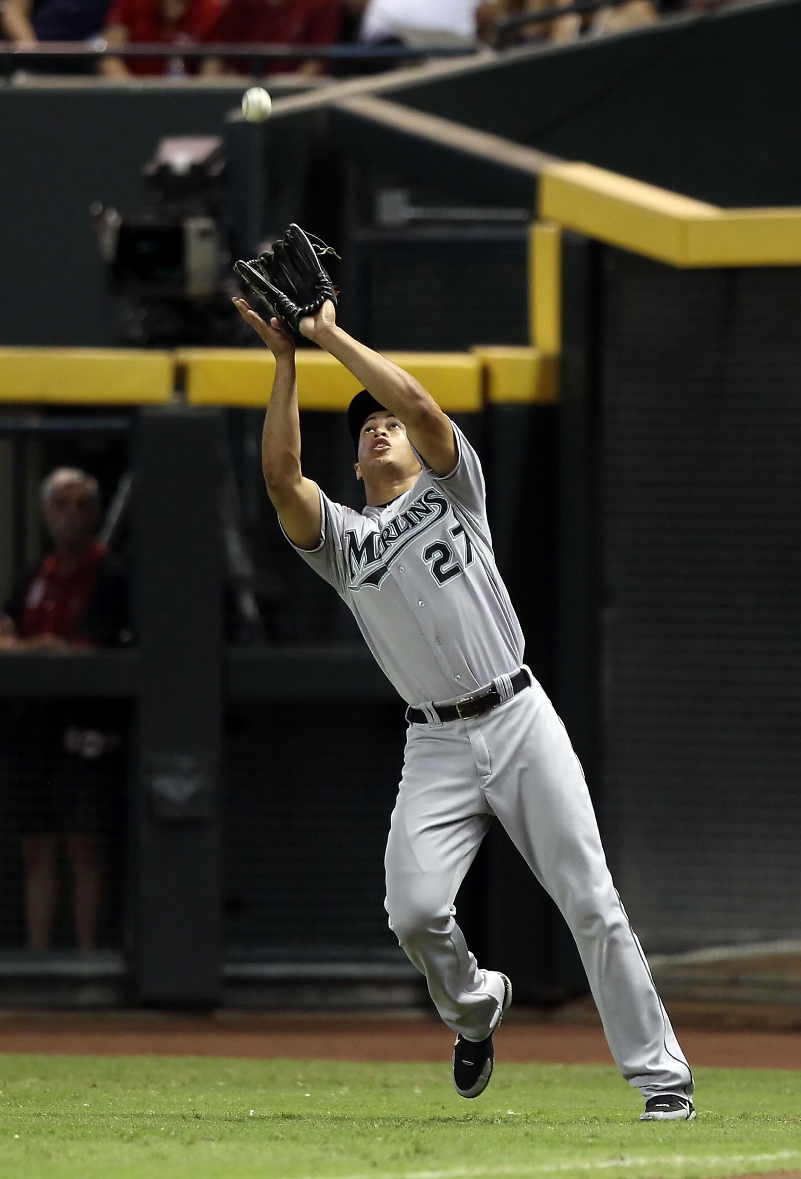 PHOENIX - JULY 10: Outfielder Mike Stanton #27 of the Florida Marlins catches a fly ball out against the Arizona Diamondbacks during the Major League Baseball game at Chase Field on July 10, 2010 in Phoenix, Arizona. The Diamondbacks defeated the Marlin PHOENIX - JULY 10: Outfielder Mike Stanton #27 of the Florida Marlins catches a fly ball out against the Arizona Diamondbacks during the Major League Baseball game at Chase Field on July 10, 2010 in Phoenix, Arizona. The Diamondbacks defeated the Marlin