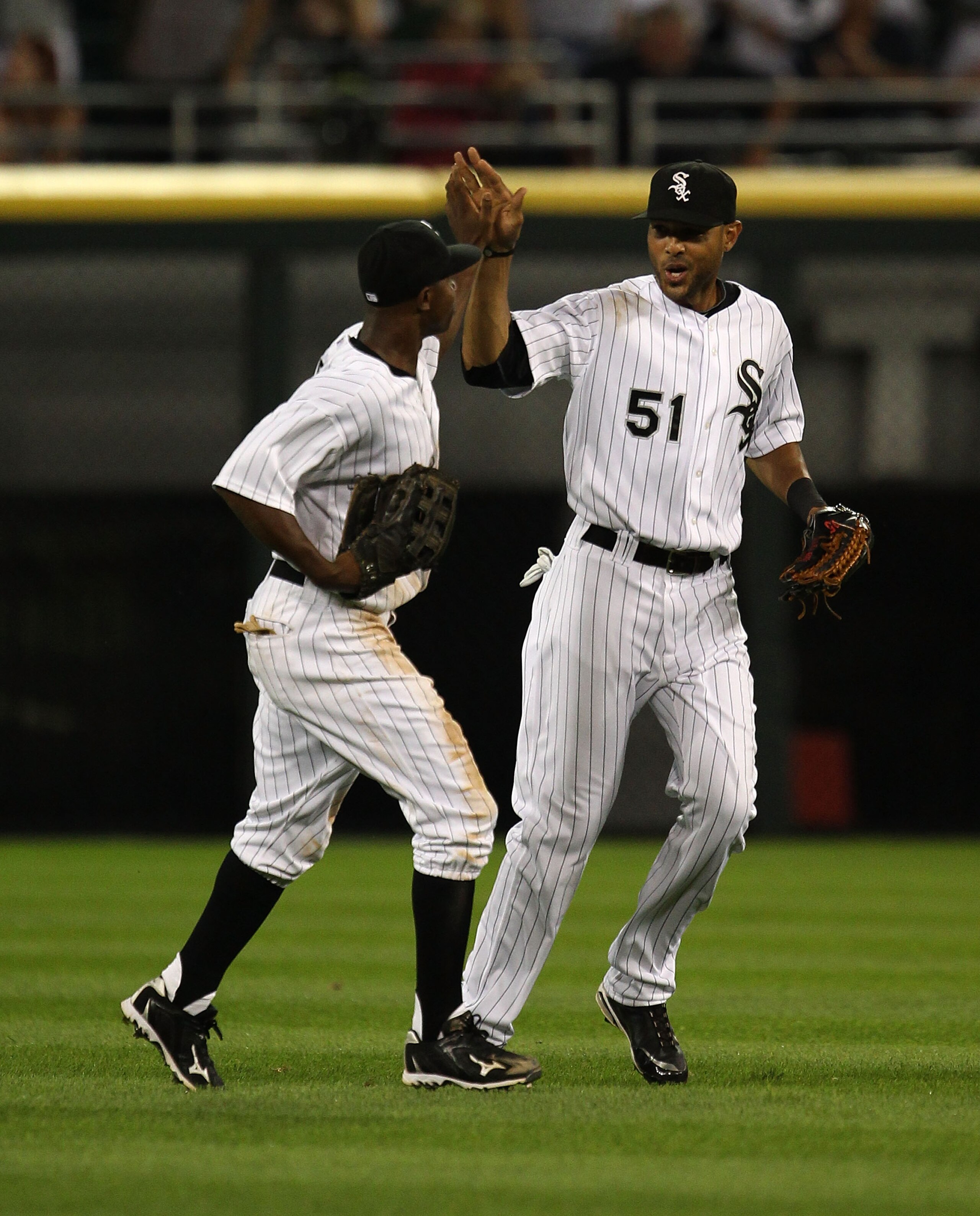 CHICAGO - JULY 26: Juan Pierre #1 (L) and Alex Rios #51 of the Chicago White Sox celebrate a win over the Seattle Mariners at U.S. Cellular Field on July 26, 2010 in Chicago, Illinois. The White Sox defeated the Mariners 6-1. (Photo by Jonathan Daniel/Get CHICAGO - JULY 26: Juan Pierre #1 (L) and Alex Rios #51 of the Chicago White Sox celebrate a win over the Seattle Mariners at U.S. Cellular Field on July 26, 2010 in Chicago, Illinois. The White Sox defeated the Mariners 6-1. (Photo by Jonathan Daniel/Get