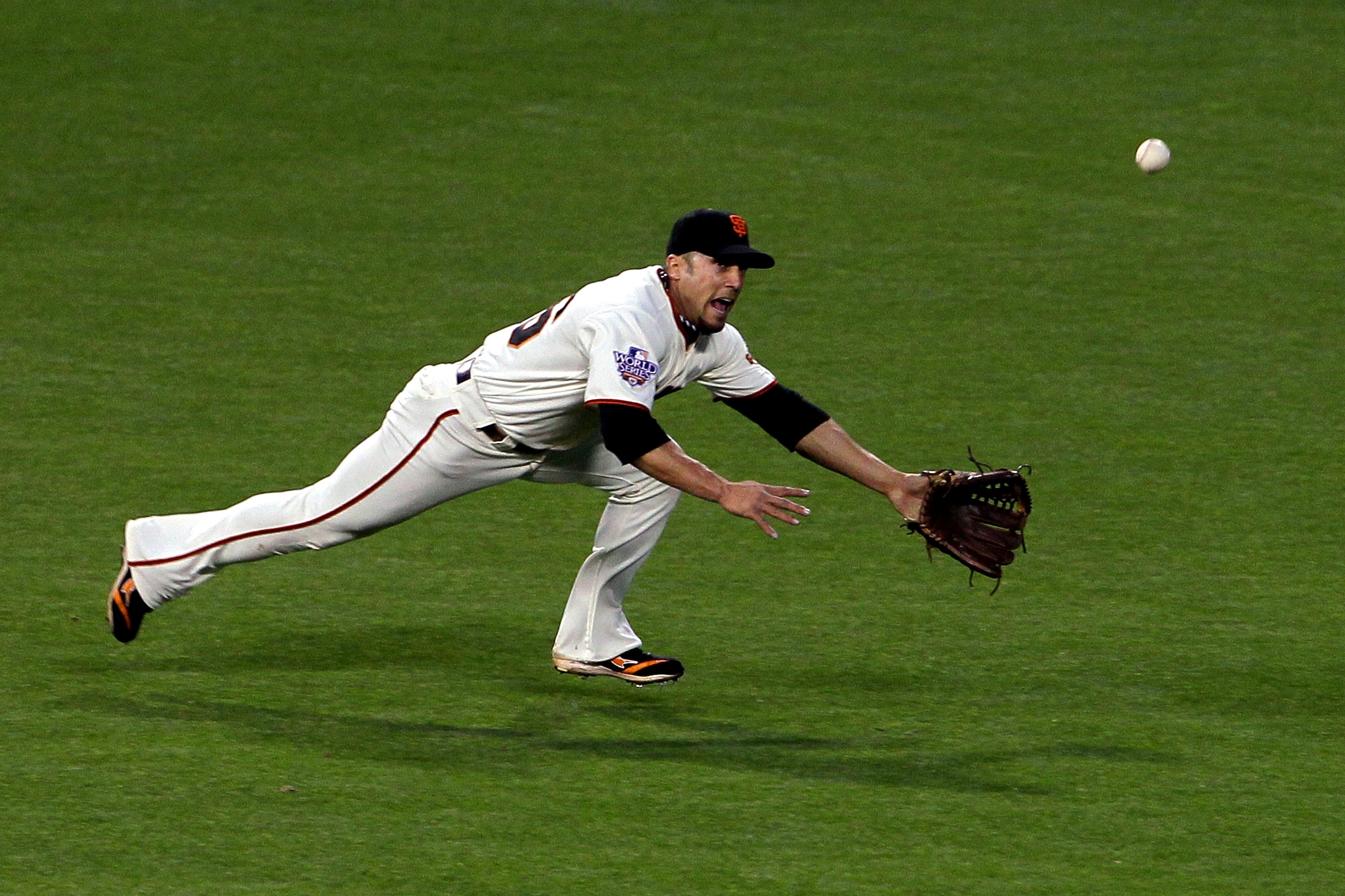 SAN FRANCISCO - OCTOBER 27: Andres Torres #56 of the San Francisco Giants fails to make a play on a ball hit to the outfield against the Texas Rangers in Game One of the 2010 MLB World Series at AT&T Park on October 27, 2010 in San Francisco, California. SAN FRANCISCO - OCTOBER 27: Andres Torres #56 of the San Francisco Giants fails to make a play on a ball hit to the outfield against the Texas Rangers in Game One of the 2010 MLB World Series at AT&T Park on October 27, 2010 in San Francisco, California.