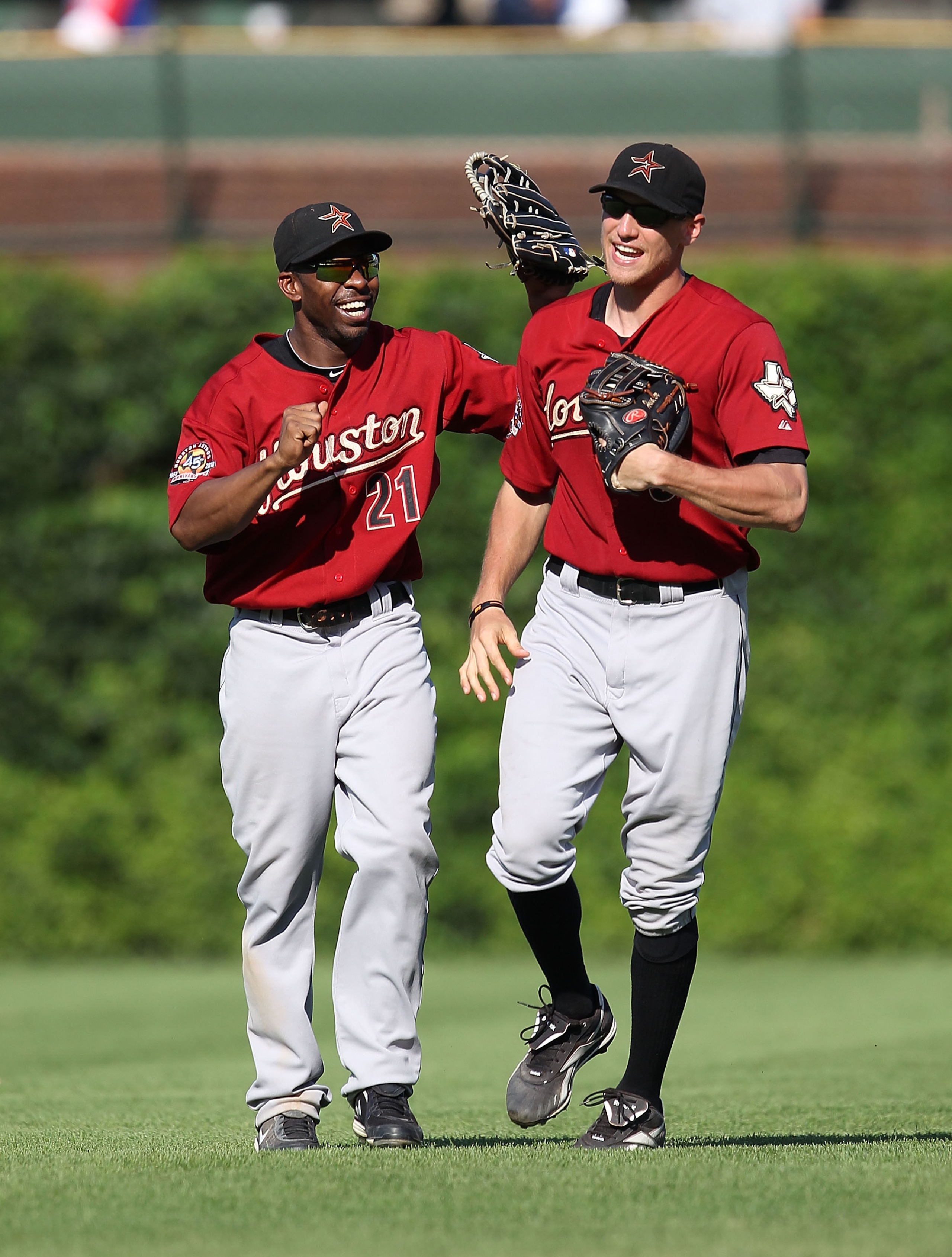 CHICAGO - JULY 21: Michael Bourn #21 and Hunter Pence #9 of the Houston Astros celebrate a win over the Chicago Cubs at Wrigley Field on July 21, 2010 in Chicago, Illinois. The Astros defeated the Cubs 4-3 in 12 innings. (Photo by Jonathan Daniel/Getty Im CHICAGO - JULY 21: Michael Bourn #21 and Hunter Pence #9 of the Houston Astros celebrate a win over the Chicago Cubs at Wrigley Field on July 21, 2010 in Chicago, Illinois. The Astros defeated the Cubs 4-3 in 12 innings. (Photo by Jonathan Daniel/Getty Im