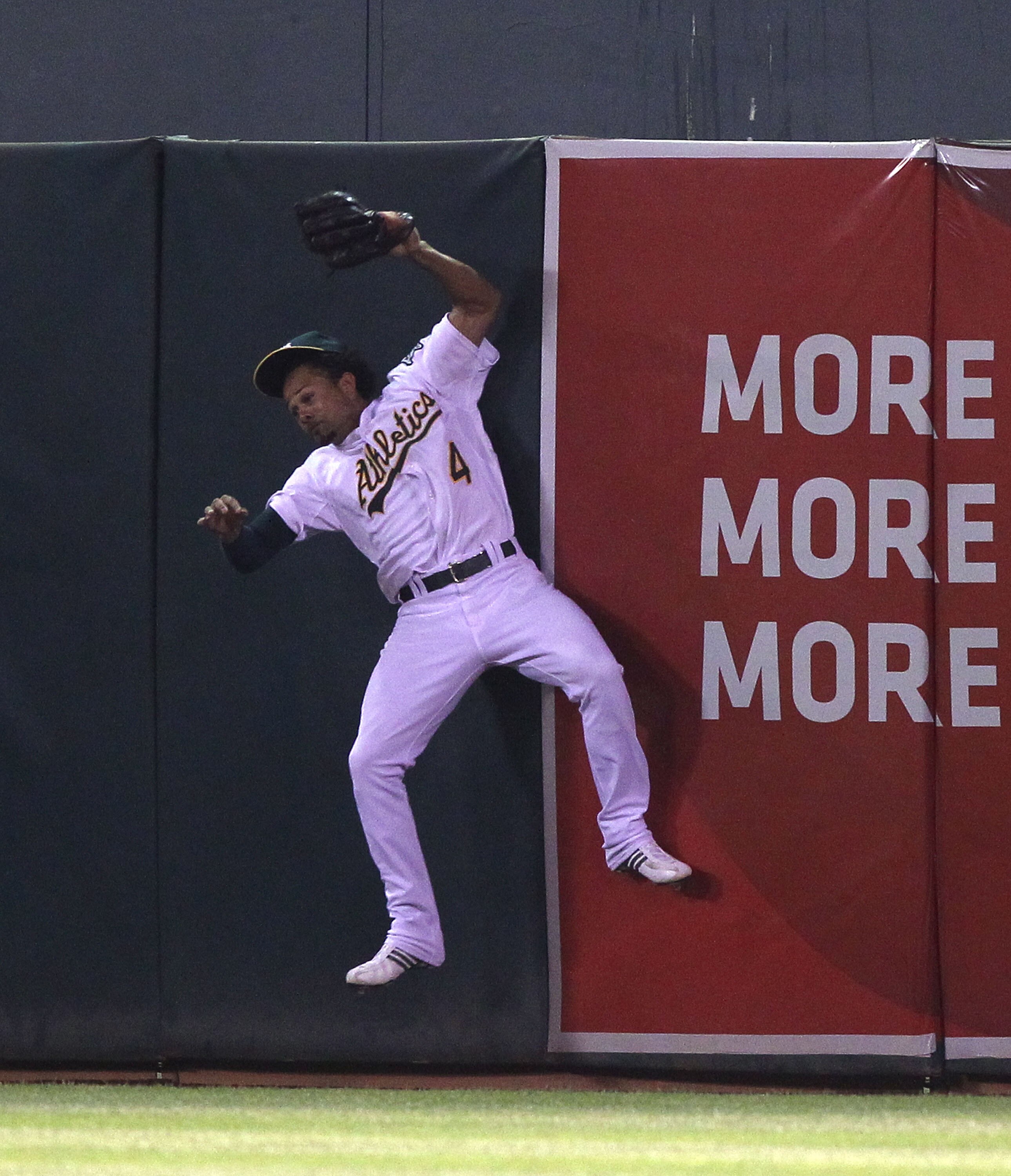 OAKLAND, CA - AUGUST 19:  Coco Crisp #4 of the Oakland Athletics catches a ball hit by Matt Joyce of the Tampa Bay Rays in the sixth inning during an MLB game at the Oakland-Alameda County Coliseum on August 19, 2010 in Oakland, California.  (Photo by Jed