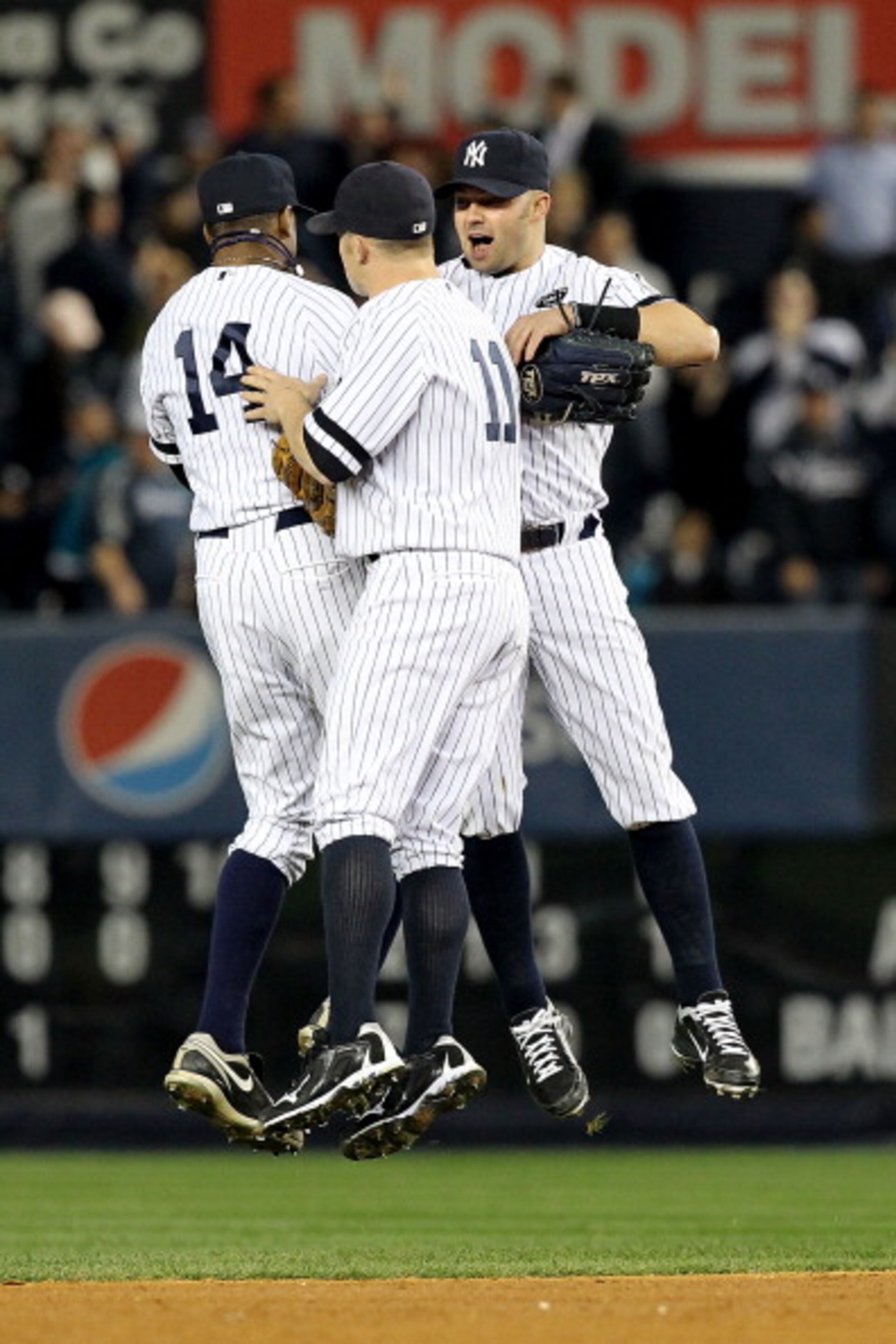 NEW YORK - OCTOBER 20: Curtis Granderson #14, Brett Gardner #11 and Nick Swisher #33 of the New York Yankees celebrate after the Yankees won 7-2 against the Texas Rangers in Game Five of the ALCS during the 2010 MLB Playoffs at Yankee Stadium on October NEW YORK - OCTOBER 20: Curtis Granderson #14, Brett Gardner #11 and Nick Swisher #33 of the New York Yankees celebrate after the Yankees won 7-2 against the Texas Rangers in Game Five of the ALCS during the 2010 MLB Playoffs at Yankee Stadium on October
