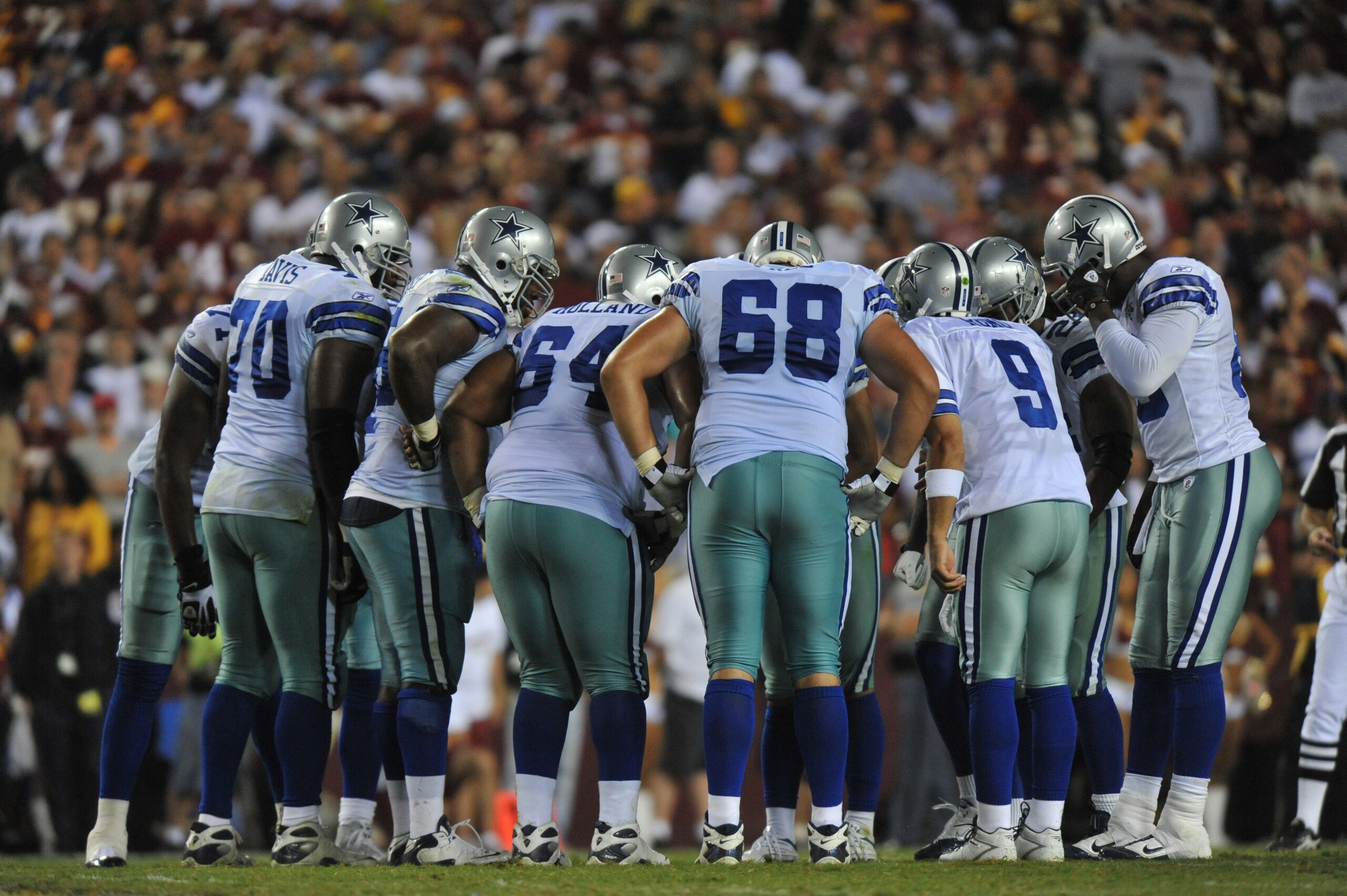 LANDOVER - SEPTEMBER 12:  The Dallas Cowboys offense huddles during the NFL season opener against the Washington Redskins at FedExField on September 12, 2010 in Landover, Maryland. The Redskins defeated the Cowboys 13-7. (Photo by Larry French/Getty Image