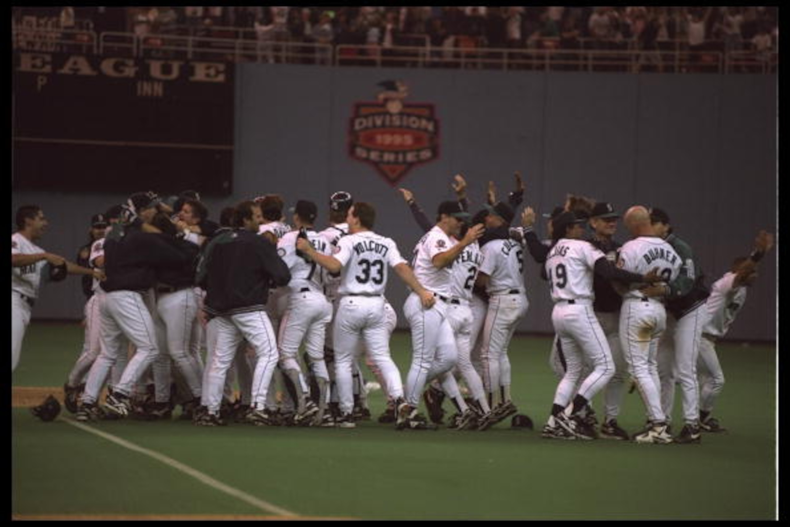 8 Oct 1995: The Seattle Mariners join-up on the field to celebrate after they clinch the American League Western Division. The Mariners defeated the New York Yankees 6-5 at the King Dome in Seattle, Wahington.
