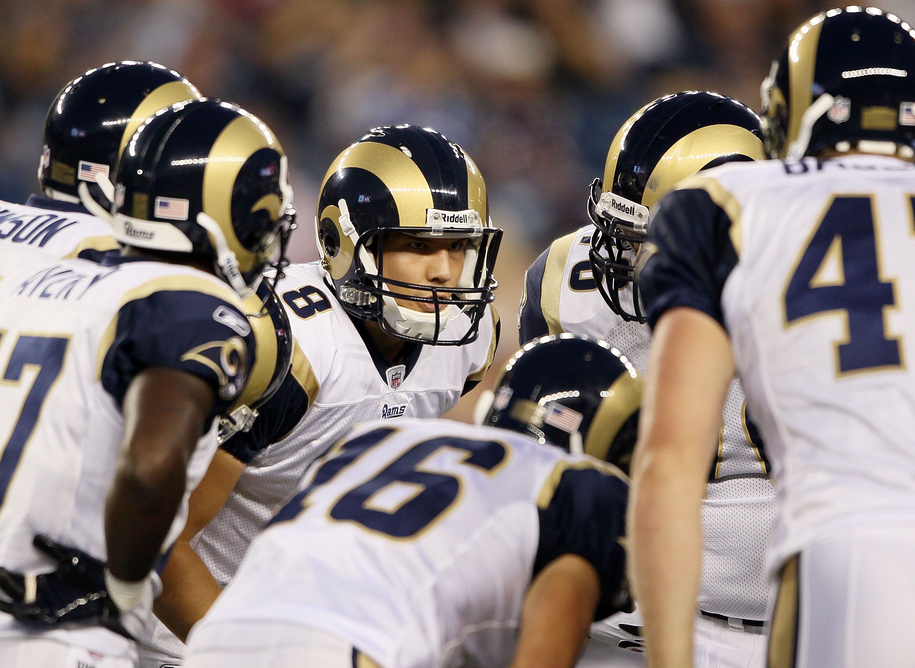 FOXBORO, MA - AUGUST 26:  Sam Bradford #8 of the St. Louis Rams talks to his teammates in the huddle in the first half against the New England Patriots on August 26, 2010 at Gillette Stadium in Foxboro, Massachusetts.  (Photo by Elsa/Getty Images)