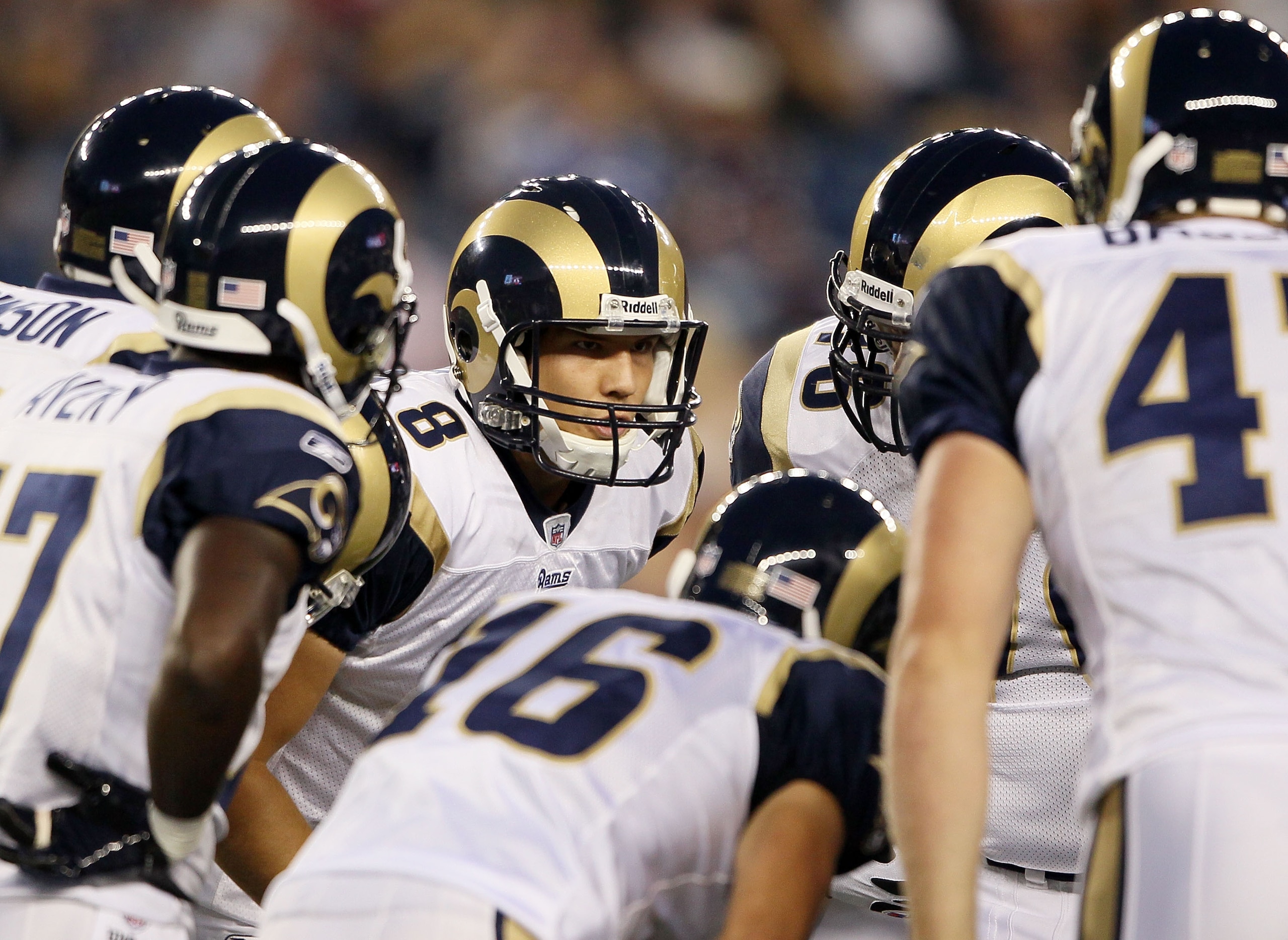 FOXBORO, MA - AUGUST 26:  Sam Bradford #8 of the St. Louis Rams talks to his teammates in the huddle in the first half against the New England Patriots on August 26, 2010 at Gillette Stadium in Foxboro, Massachusetts.  (Photo by Elsa/Getty Images)