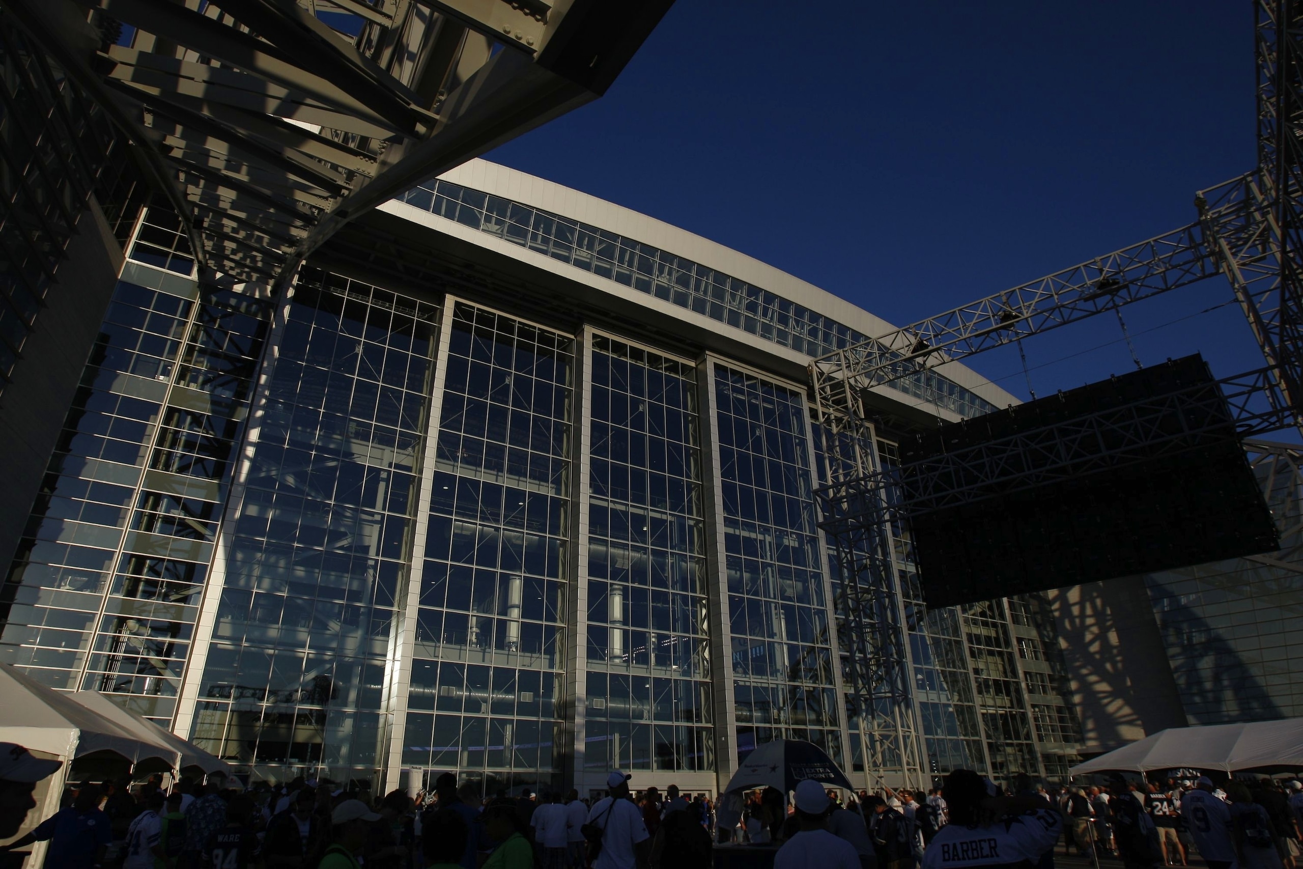 ARLINGTON, TX - SEPTEMBER 28:  Fans walk outside of Cowboys Stadium prior to the Dallas Cowboys game against the Carolina Panthers on September 28, 2009 in Arlington, Texas. (Photo by Ronald Martinez/Getty Images)