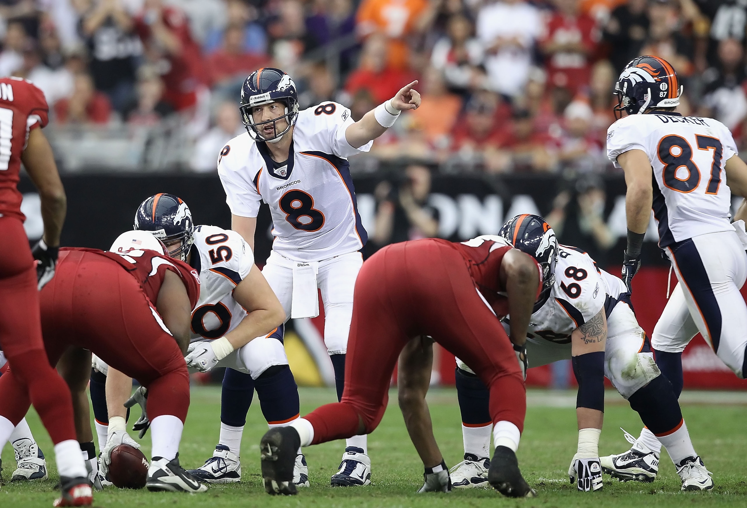 GLENDALE, AZ - DECEMBER 12:  Quarterback Kyle Orton #8 of the Denver Broncos prepares to snap the ball during the NFL game against the Arizona Cardinals at the University of Phoenix Stadium on December 12, 2010 in Glendale, Arizona.  The Cardinals defeate