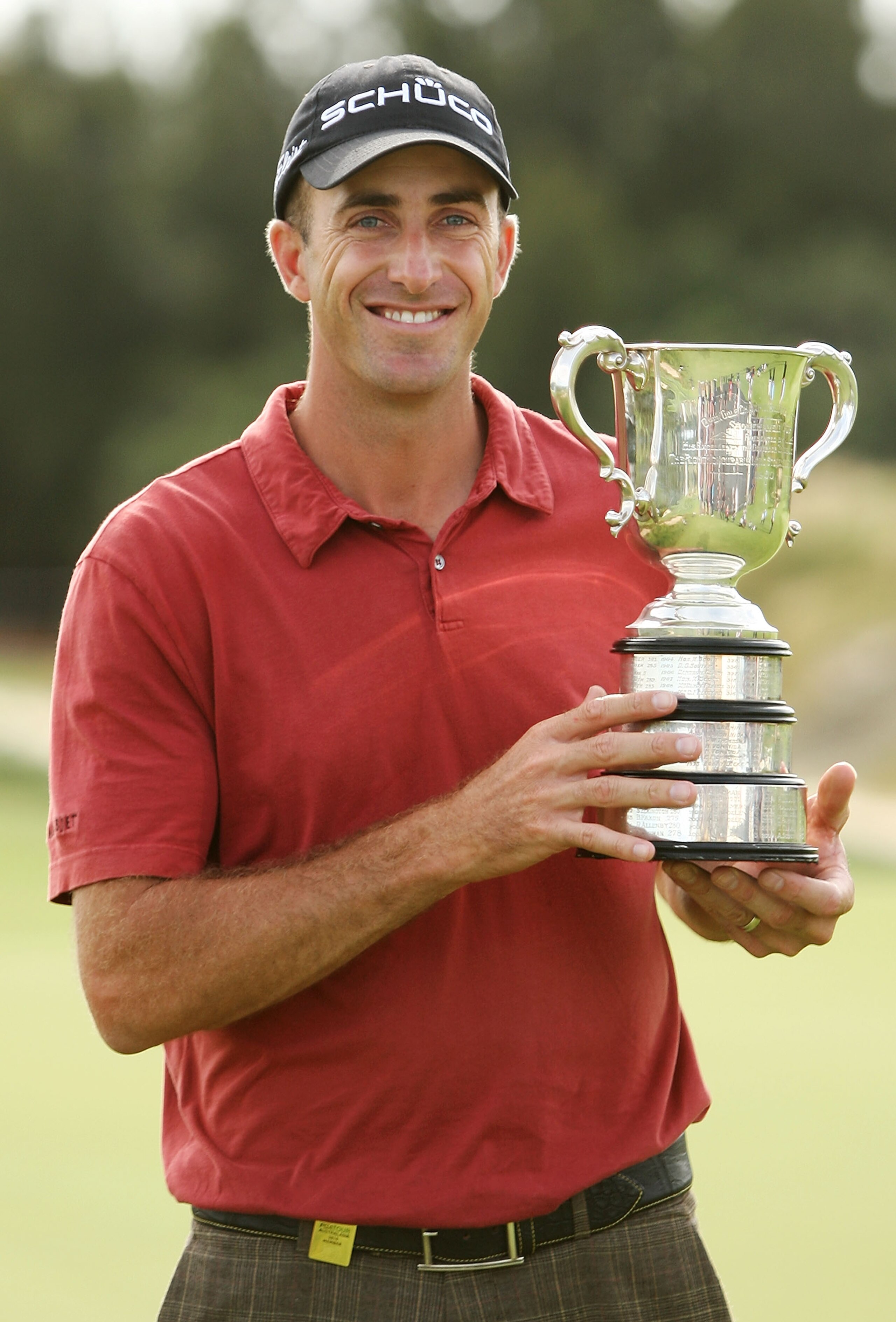 SYDNEY, AUSTRALIA - DECEMBER 05: Geoff Ogilvy of Australia poses with the trophy after winning the Australian Open during day four of the Australian Open at The Lakes Golf Club on December 5, 2010 in Sydney, Australia. (Photo by Mark Metcalfe/Getty Imag SYDNEY, AUSTRALIA - DECEMBER 05: Geoff Ogilvy of Australia poses with the trophy after winning the Australian Open during day four of the Australian Open at The Lakes Golf Club on December 5, 2010 in Sydney, Australia. (Photo by Mark Metcalfe/Getty Imag